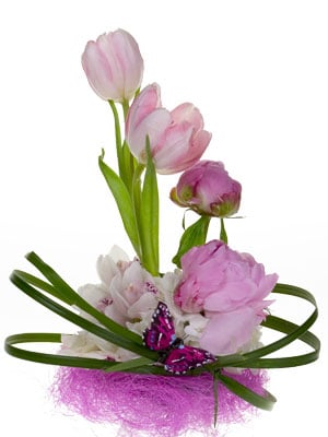 Choose spring flowers and tuck them into the base.