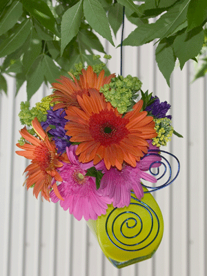 Hang party vases from tree branches or umbrellas for a unique and stylish display.
