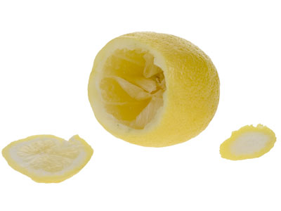 Remove the top 1/4 of the lemons and the bottom tip, then remove the inner flesh so it will hold a piece of foam.