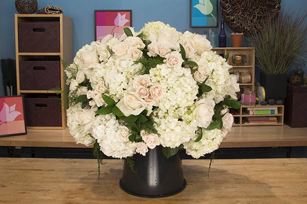 Insert roses and spray roses into the design.