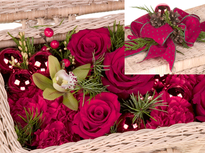 Insert roses, carnations, berries, evergreens, glass balls, and one miniature cymbidium orchid.