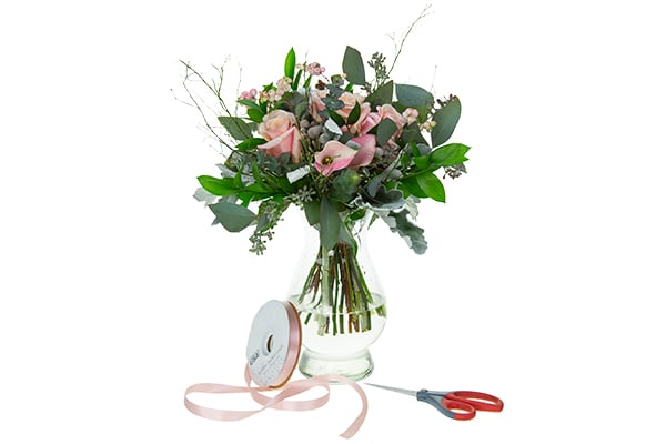 a hand-tied bouquet with ribbon and shears.