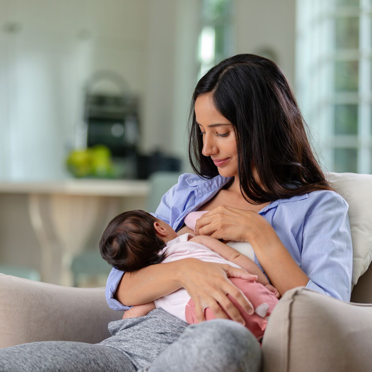 mom breastfeeding baby