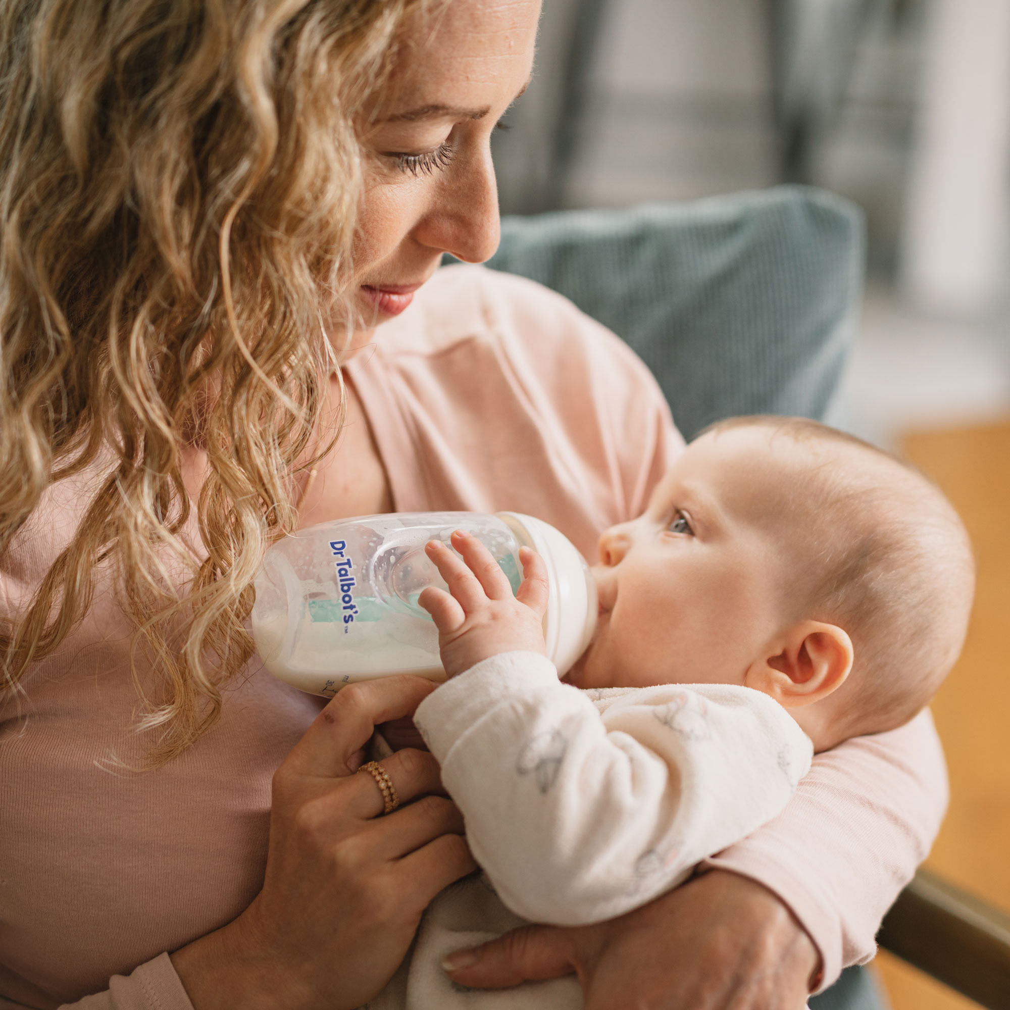 mommy bottle feeding a baby