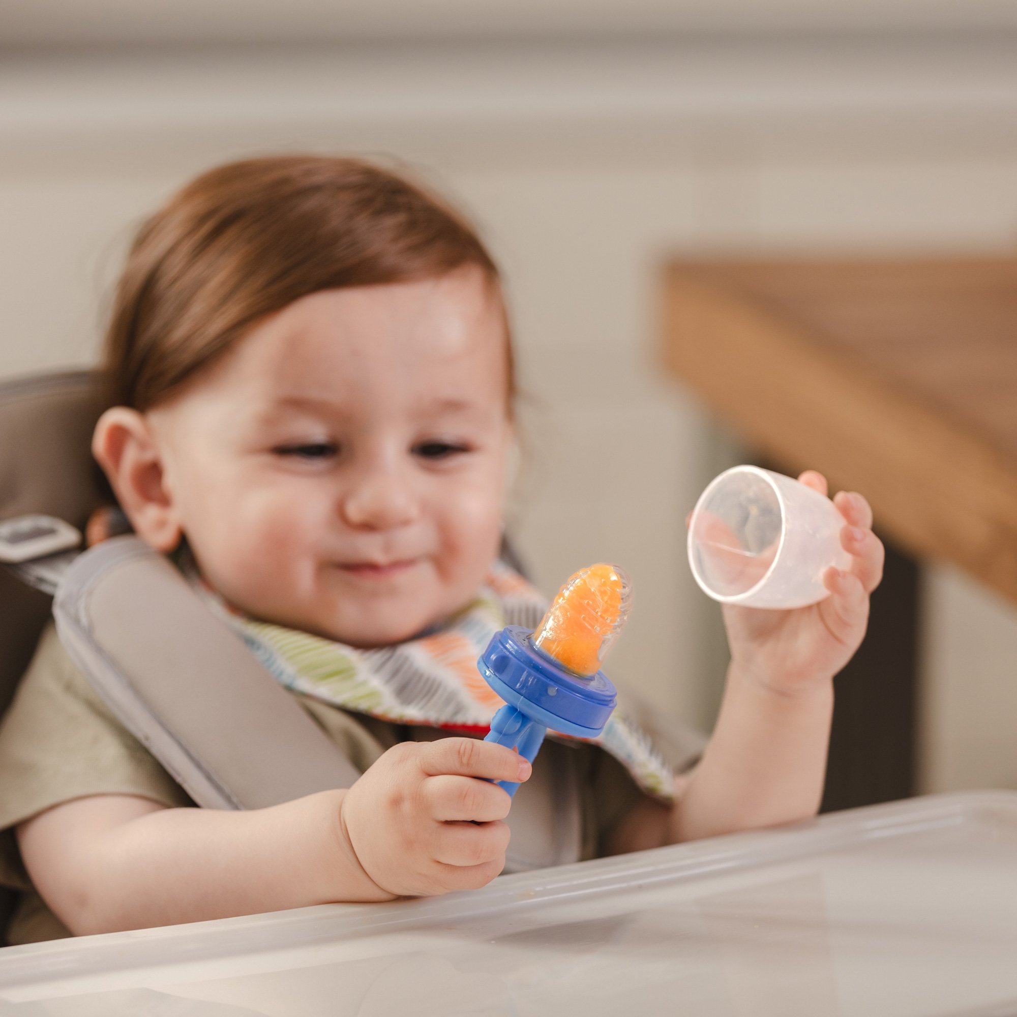 Baby trying out solid food