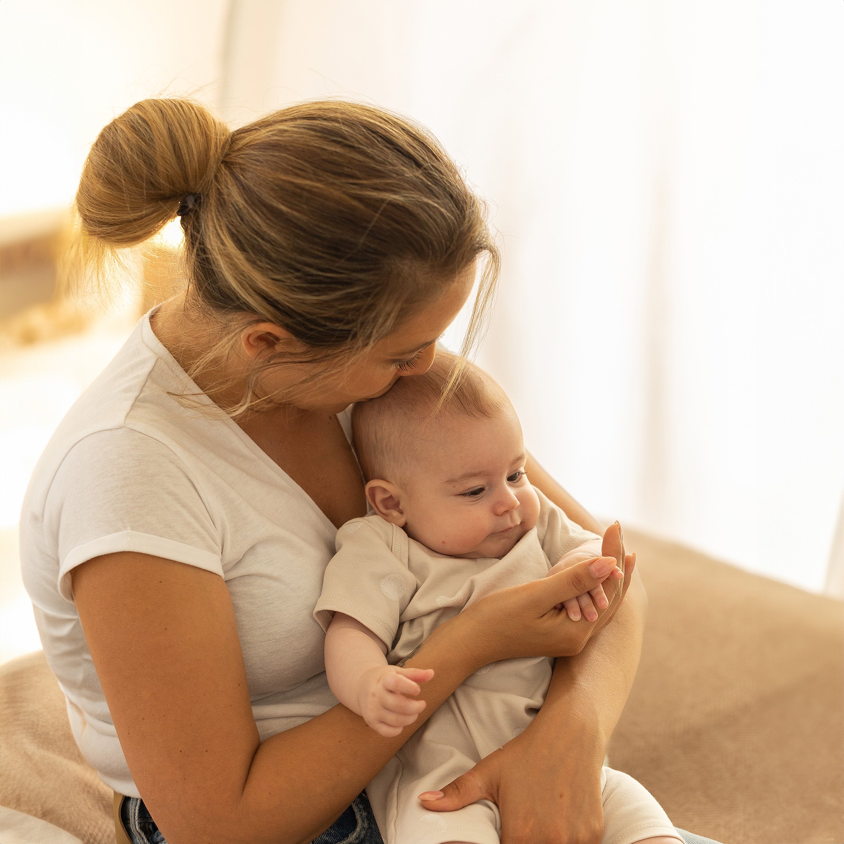 mom with baby in bedroom