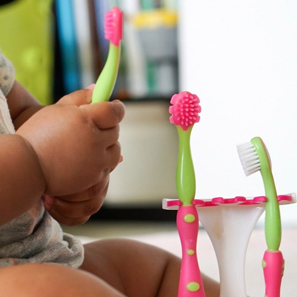 baby with toothbrush