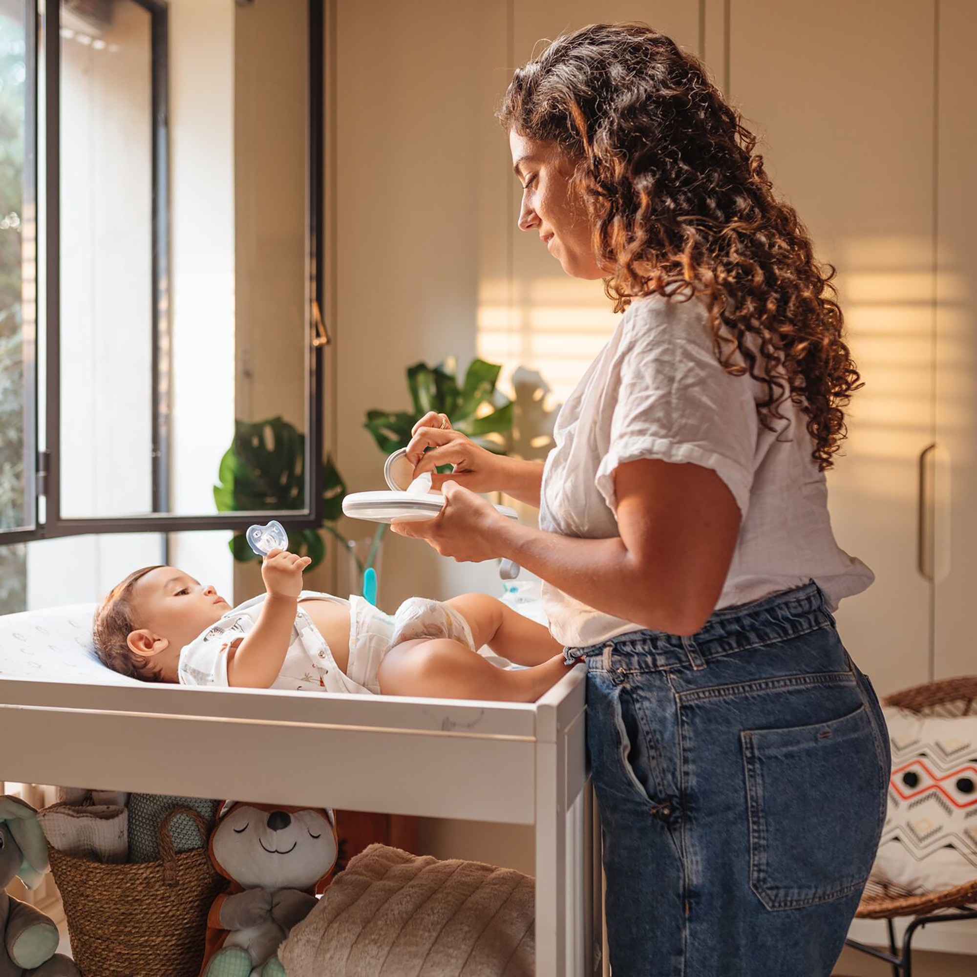 Mom cleaning baby