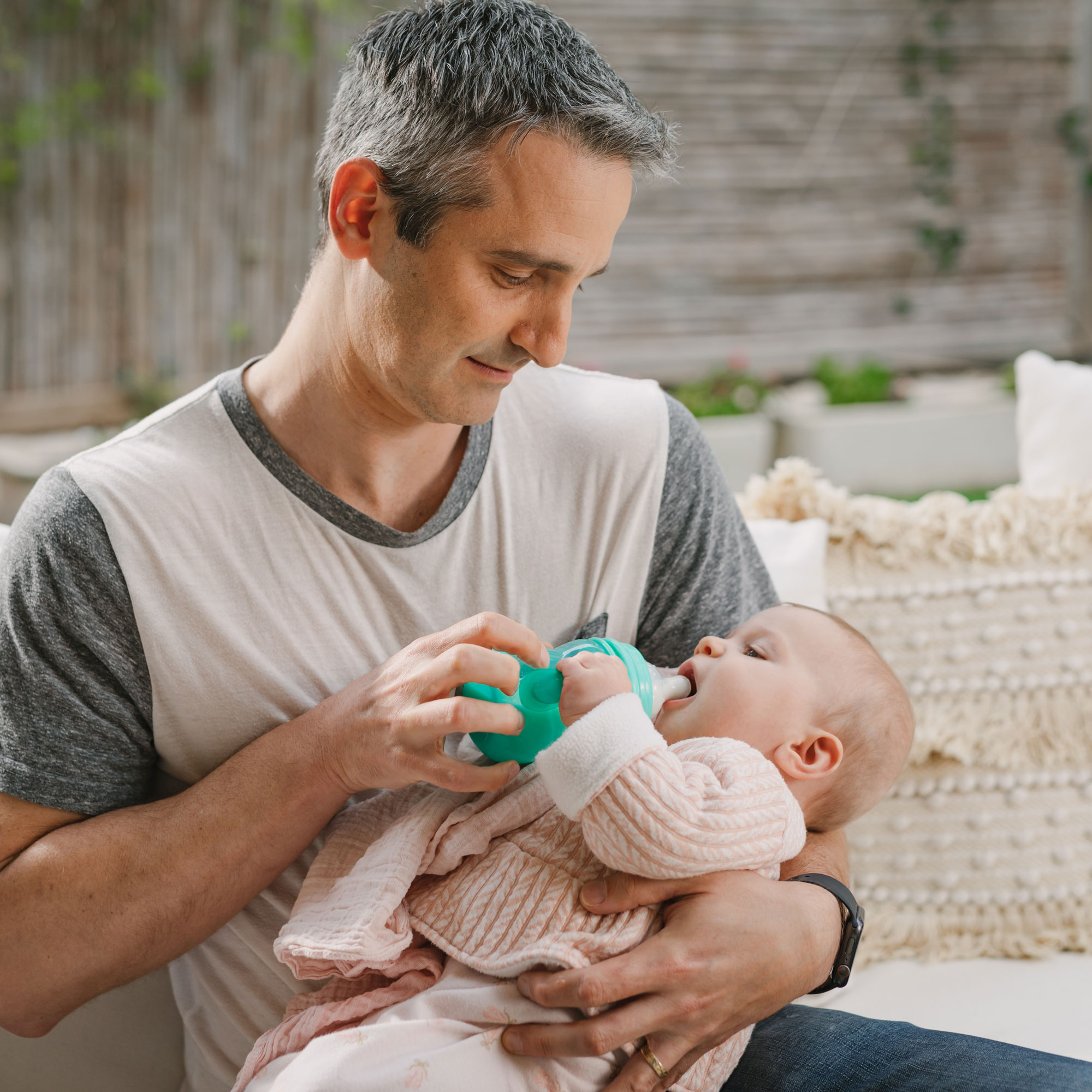 Father feeding baby