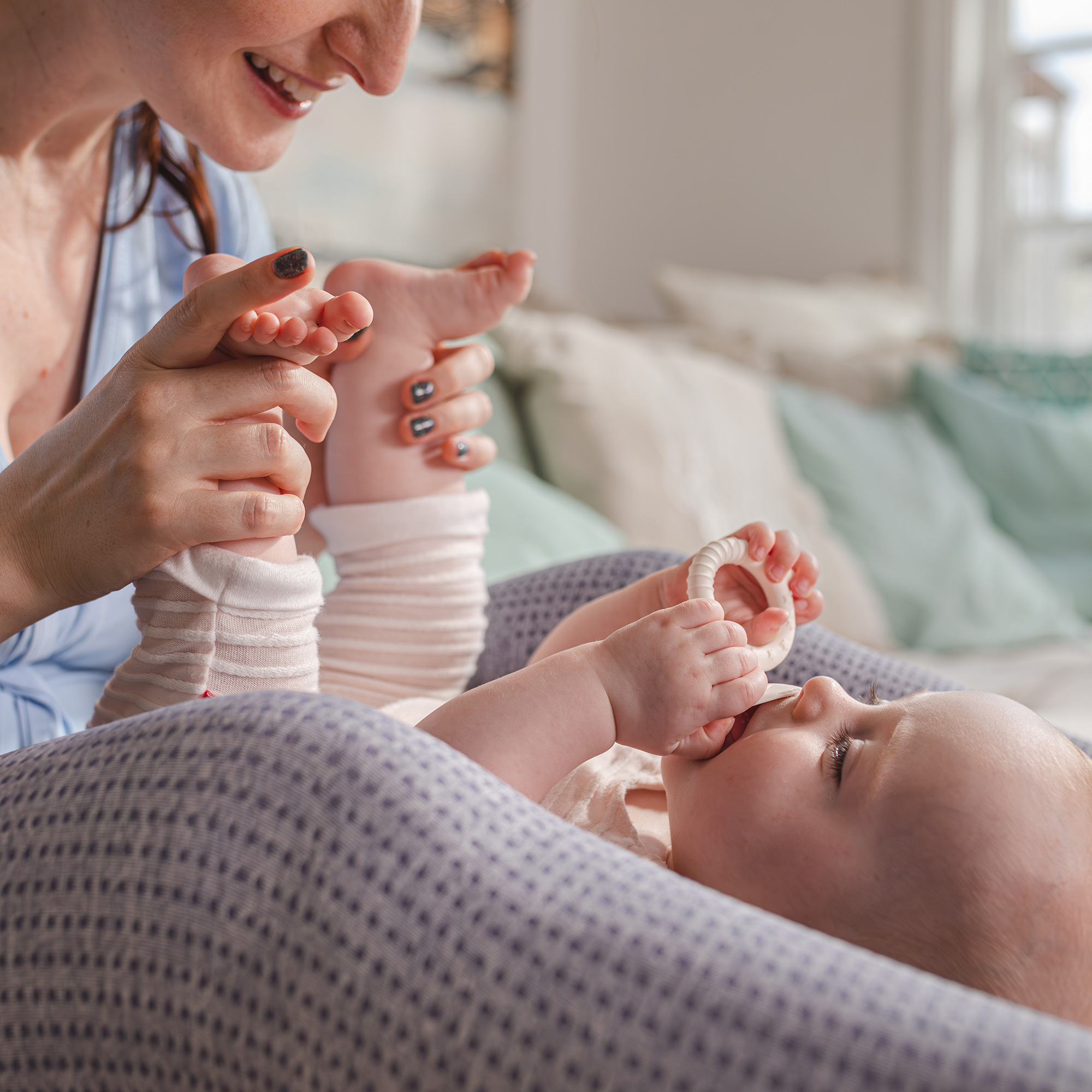 mom playing with baby's feet
