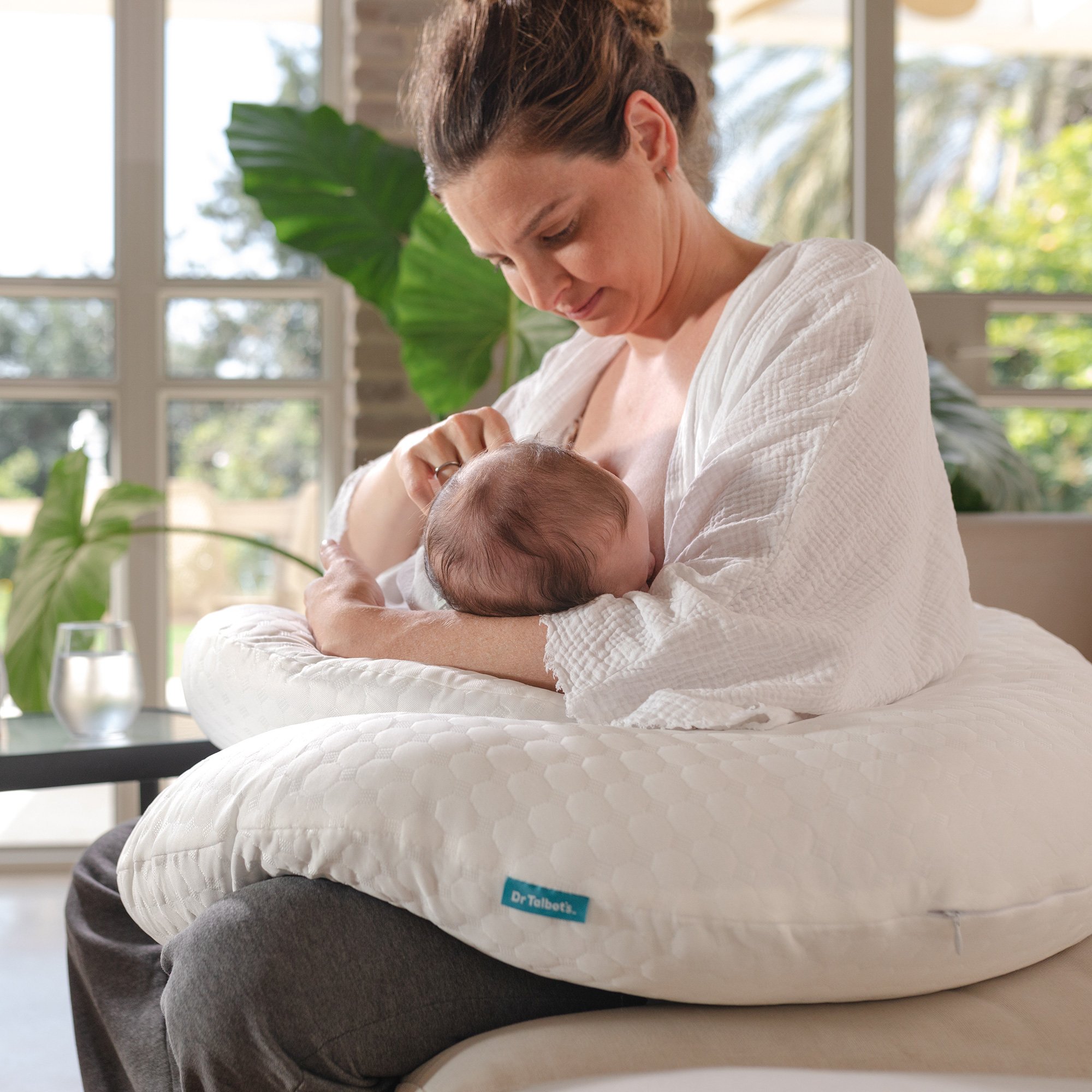 Mom breastfeeding her baby with support