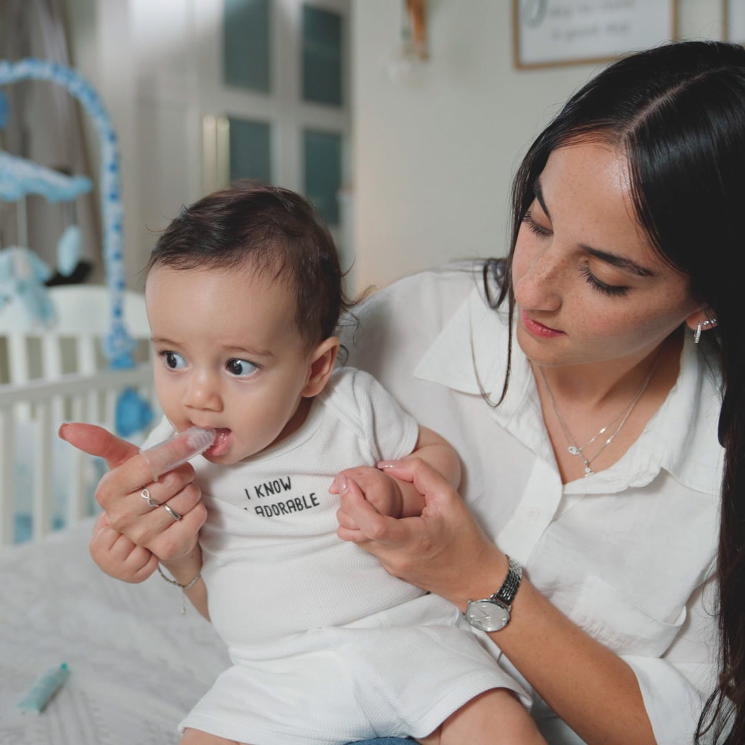 mom giving baby Dr Talbot's Tooth Gel