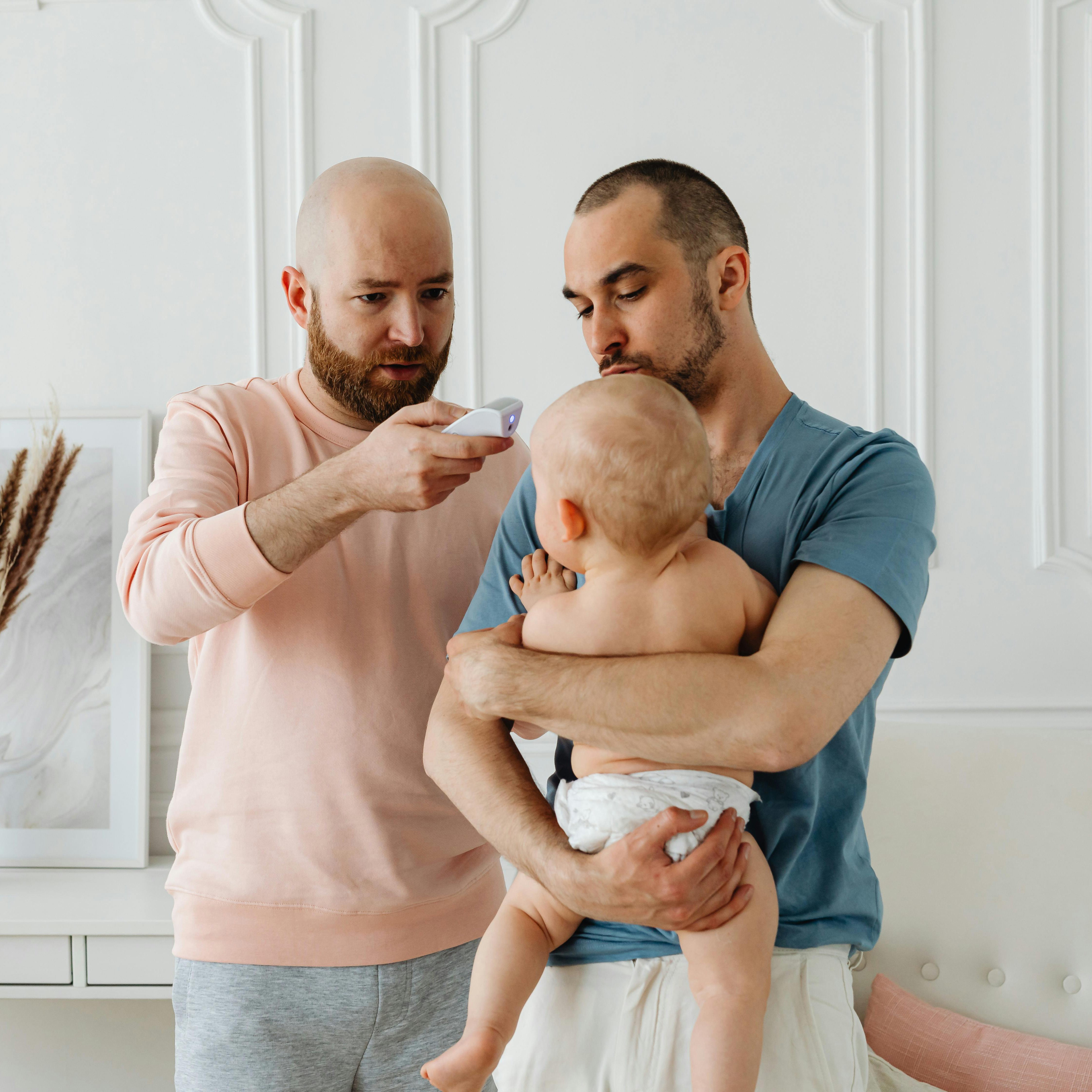 parents getting temperature for baby