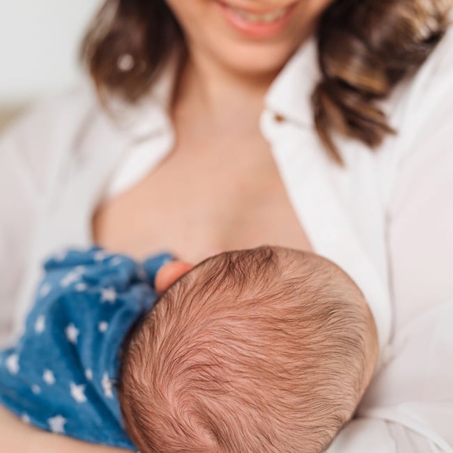 Mother breastfeeding baby.