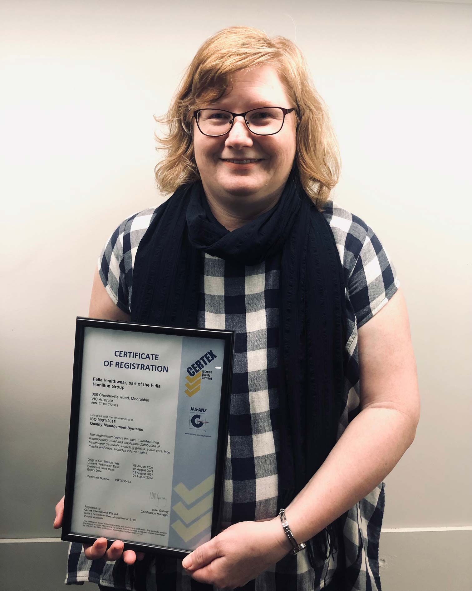 Samantha holding our certification