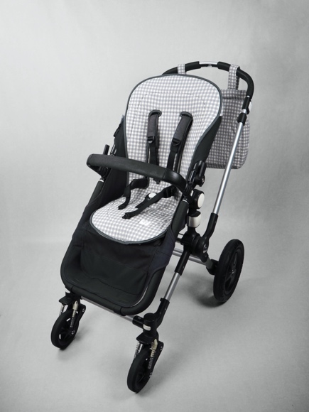 A baby stroller with wheels

Description automatically generated with low confidence