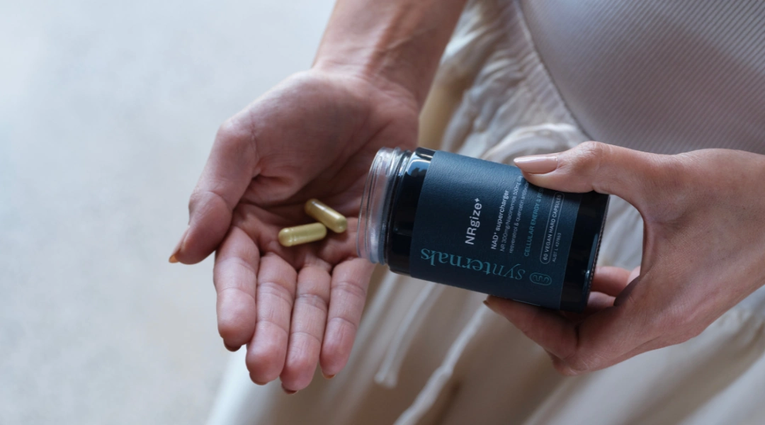 Pouring our SynTernals supplement onto hand