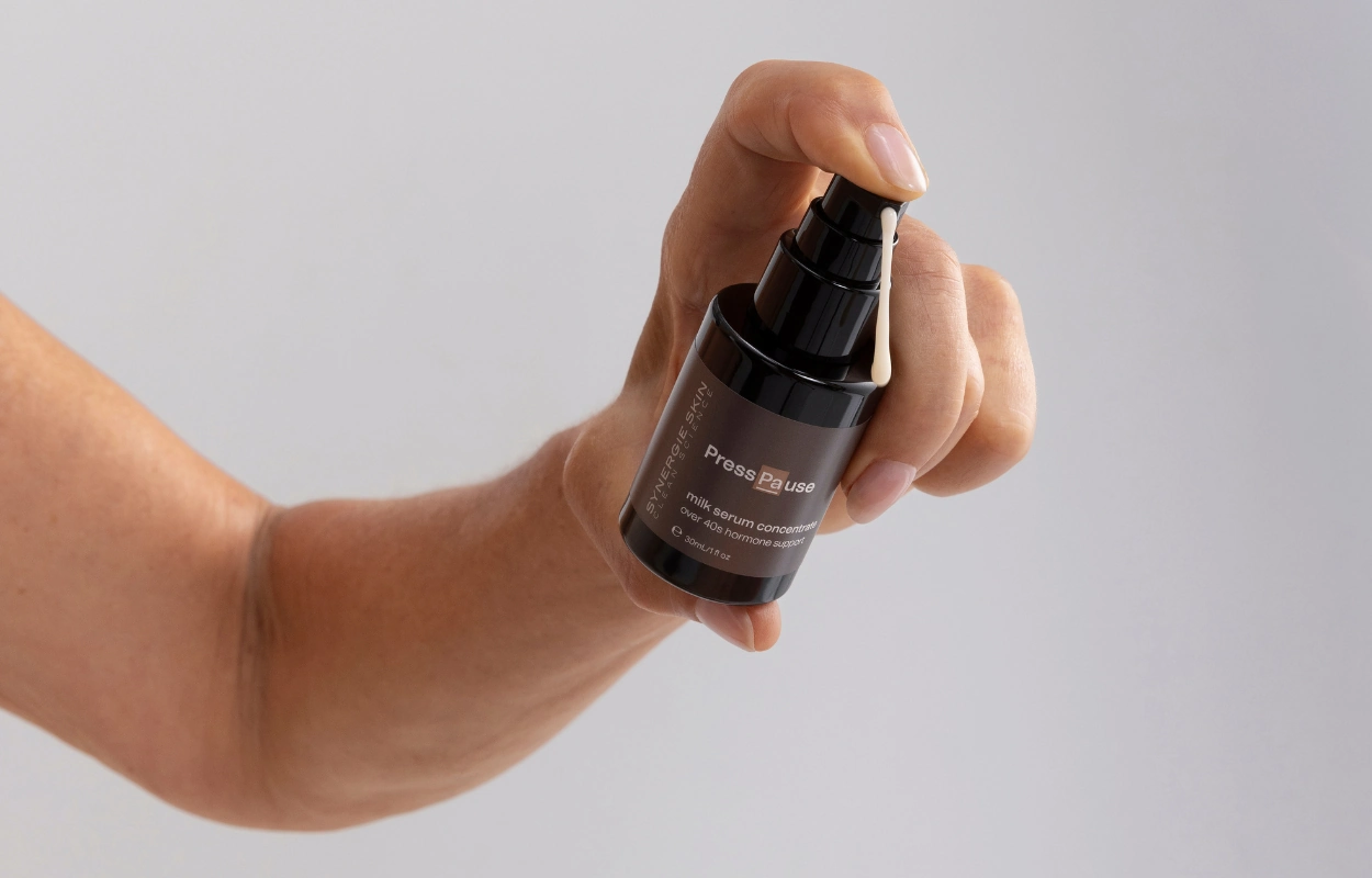 Synergie Skin PressPause being held by model hand