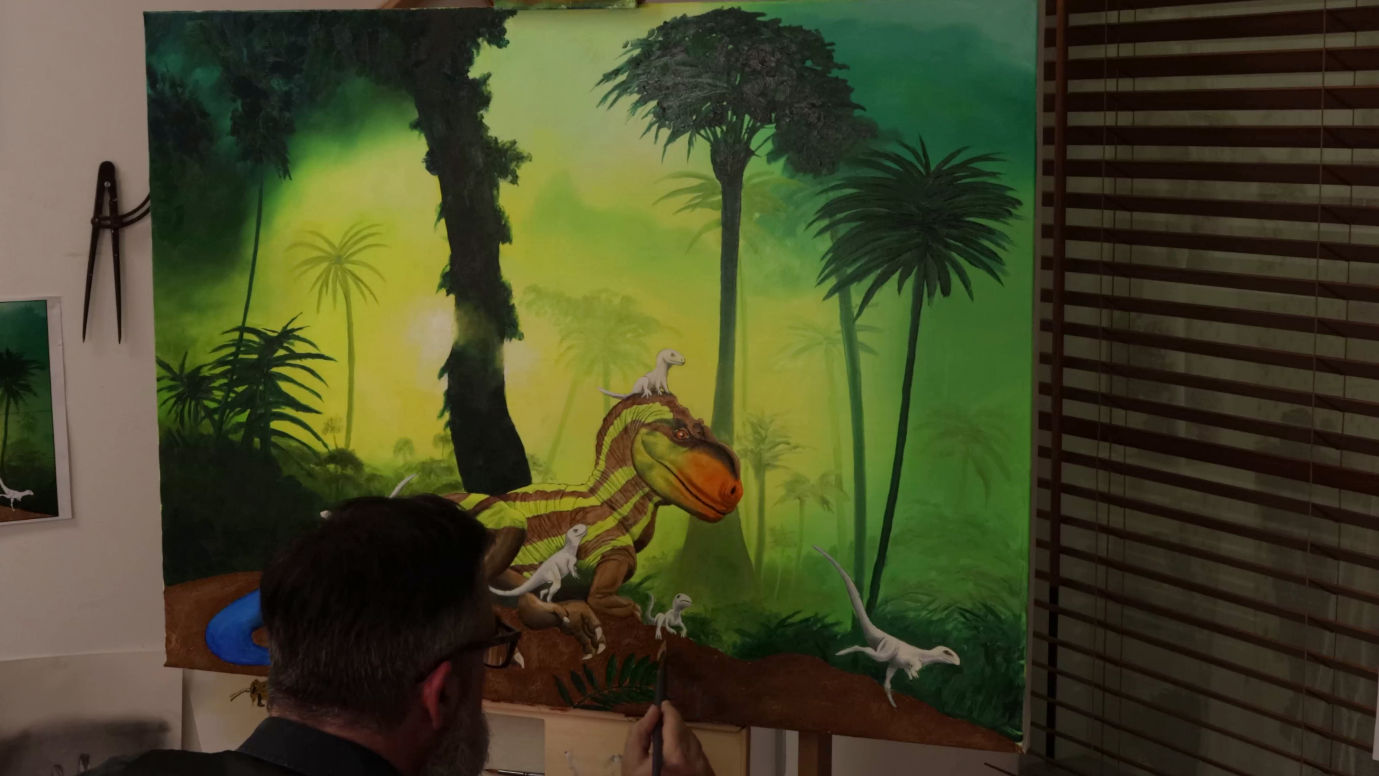 A person painting a dinosaurDescription automatically generated