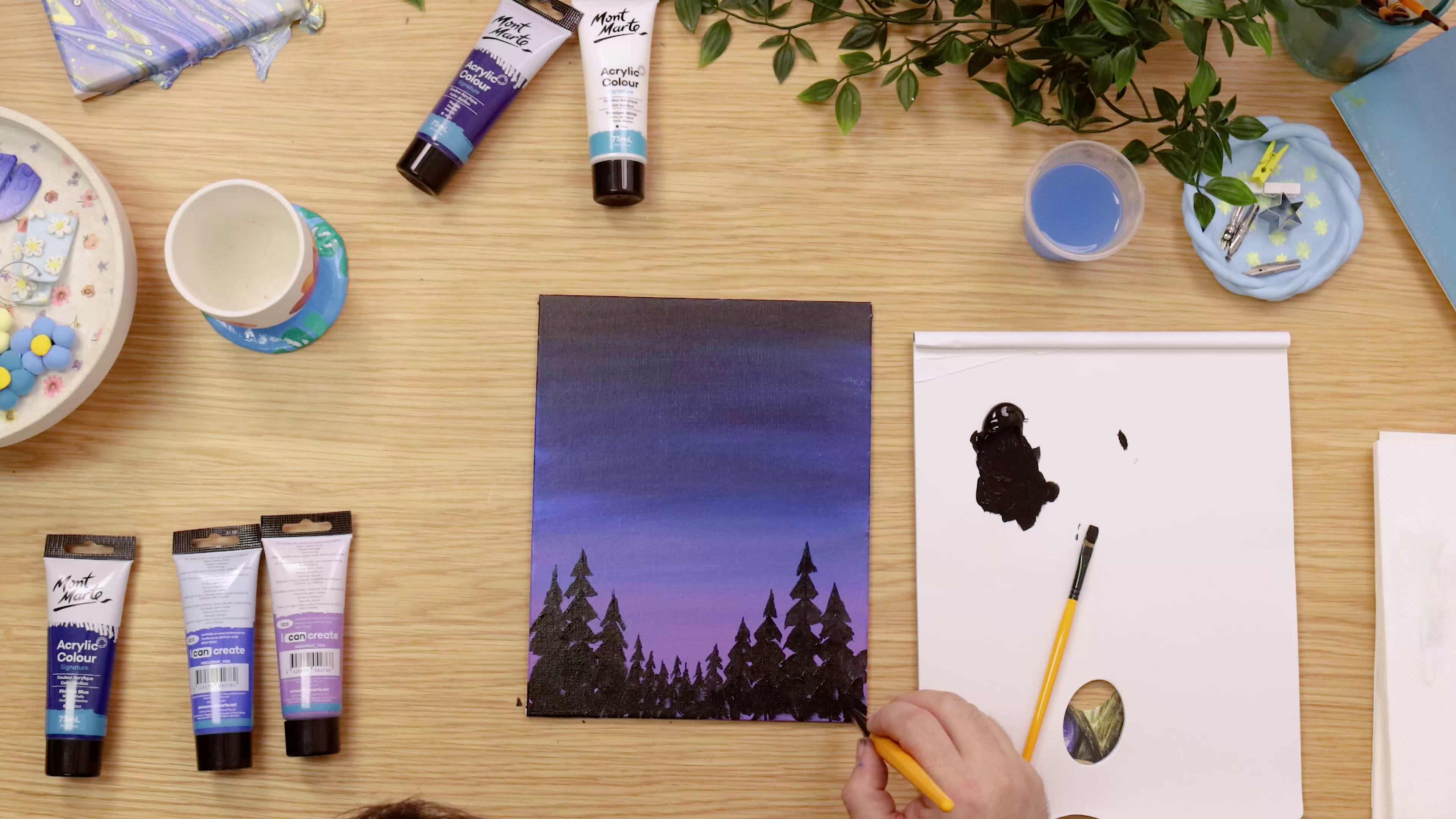 Gradient night sky painting with trees in foreground