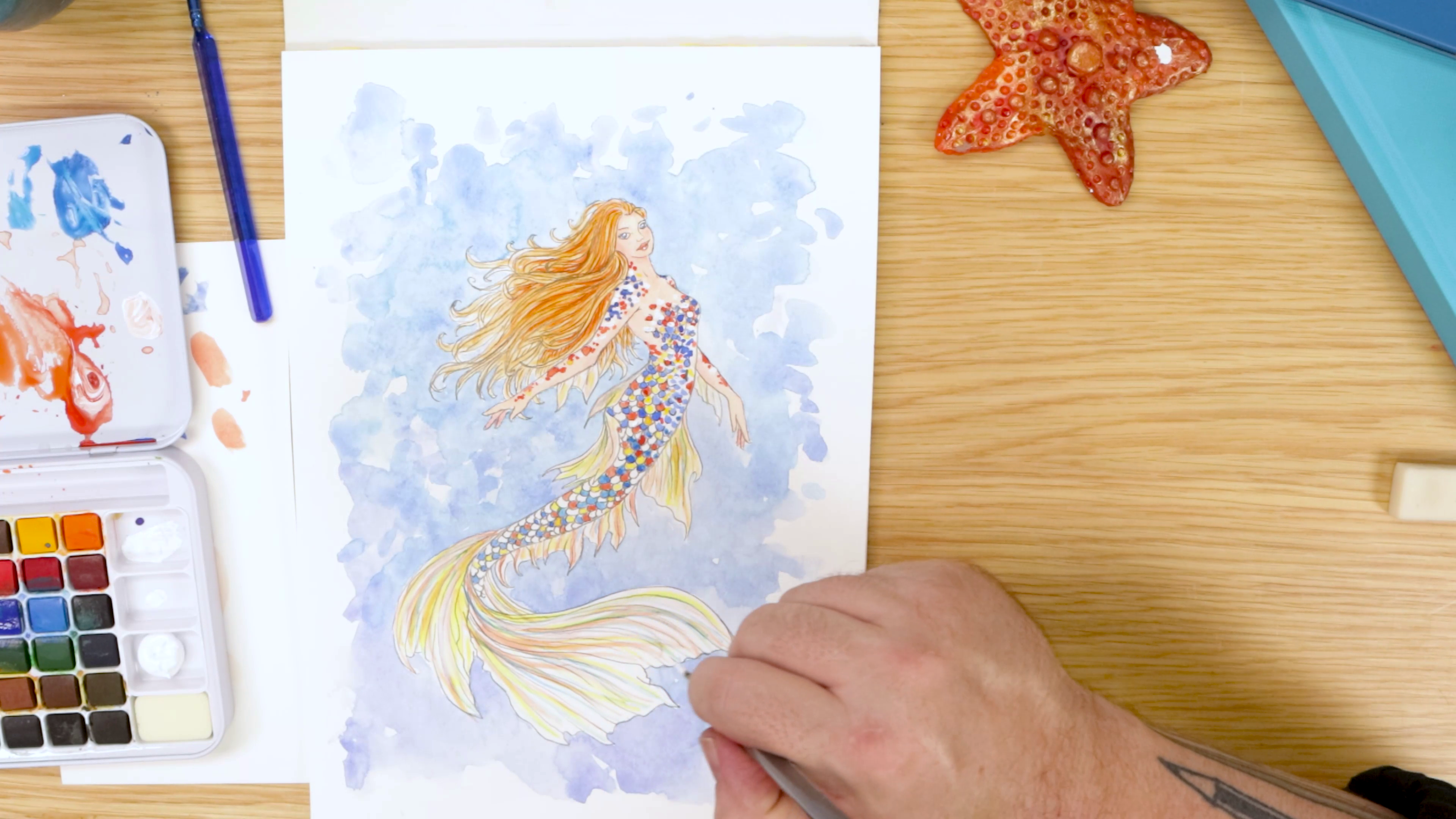 Painting mermaid tail with watercolour
