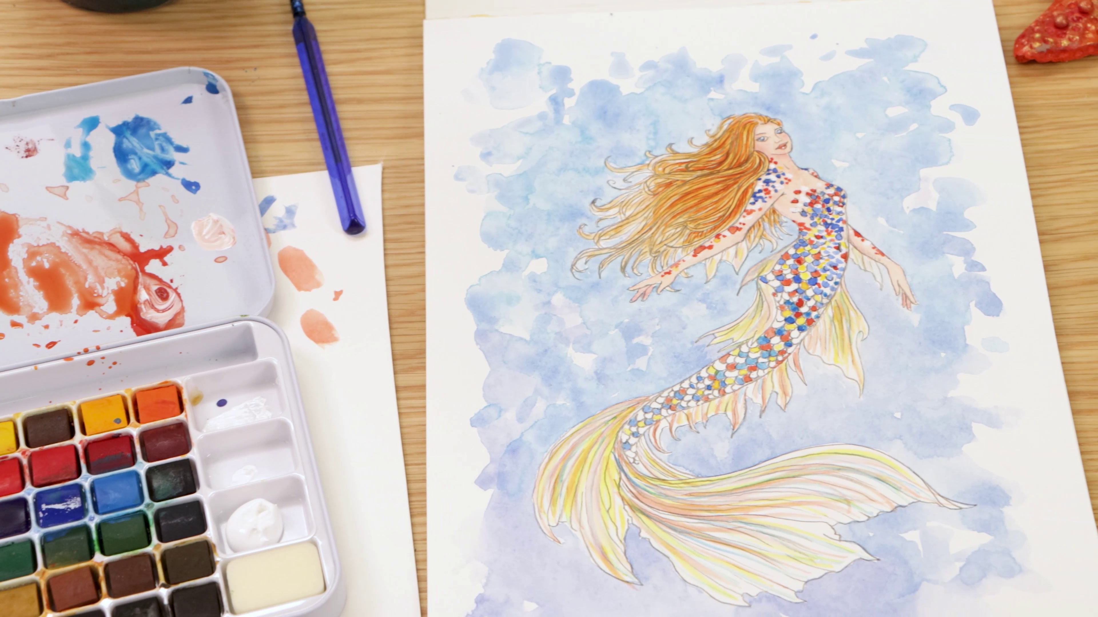 Mermaid with colourful scales painted in watercolour