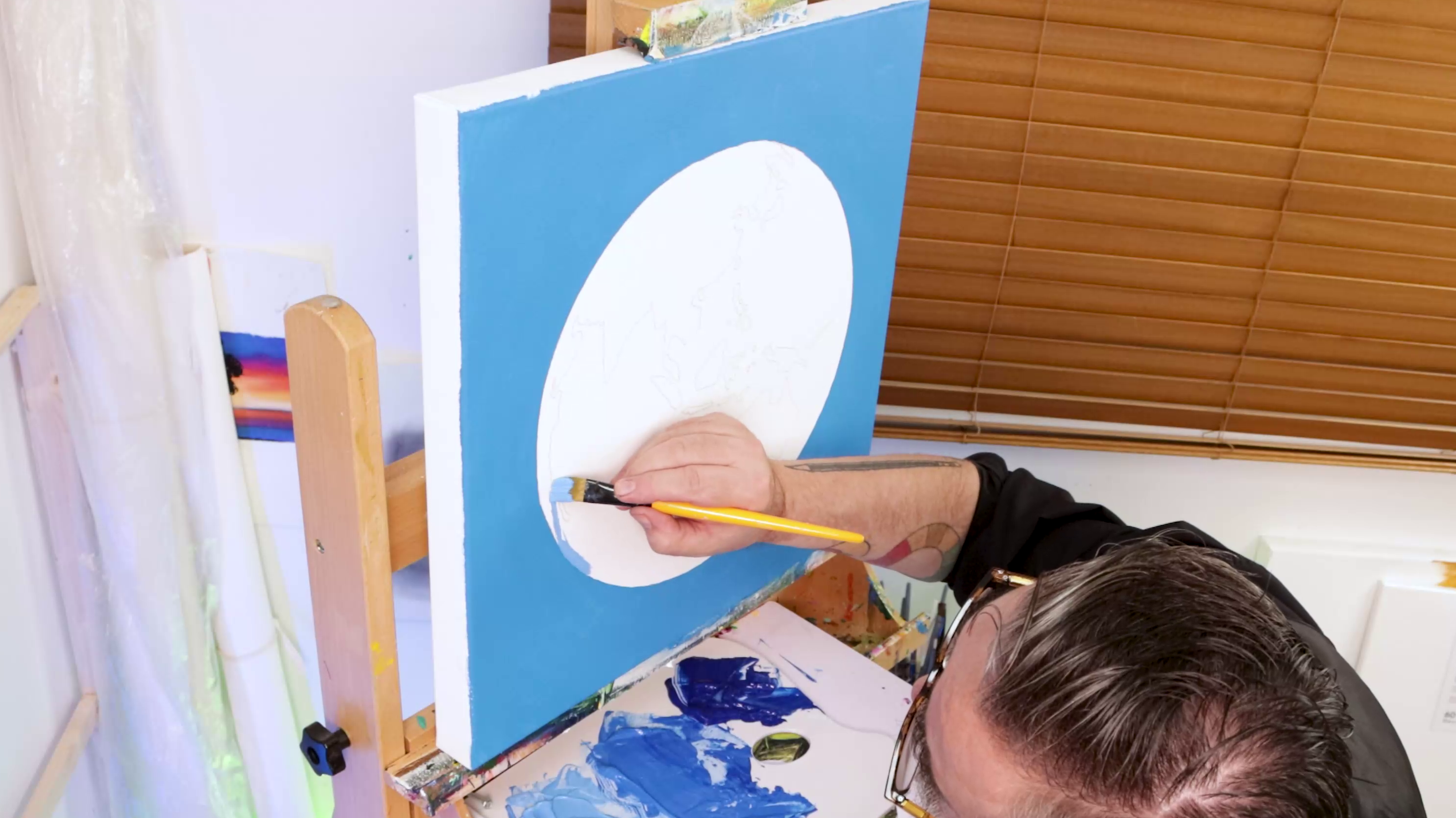Blue background around earth drawing on canvas
