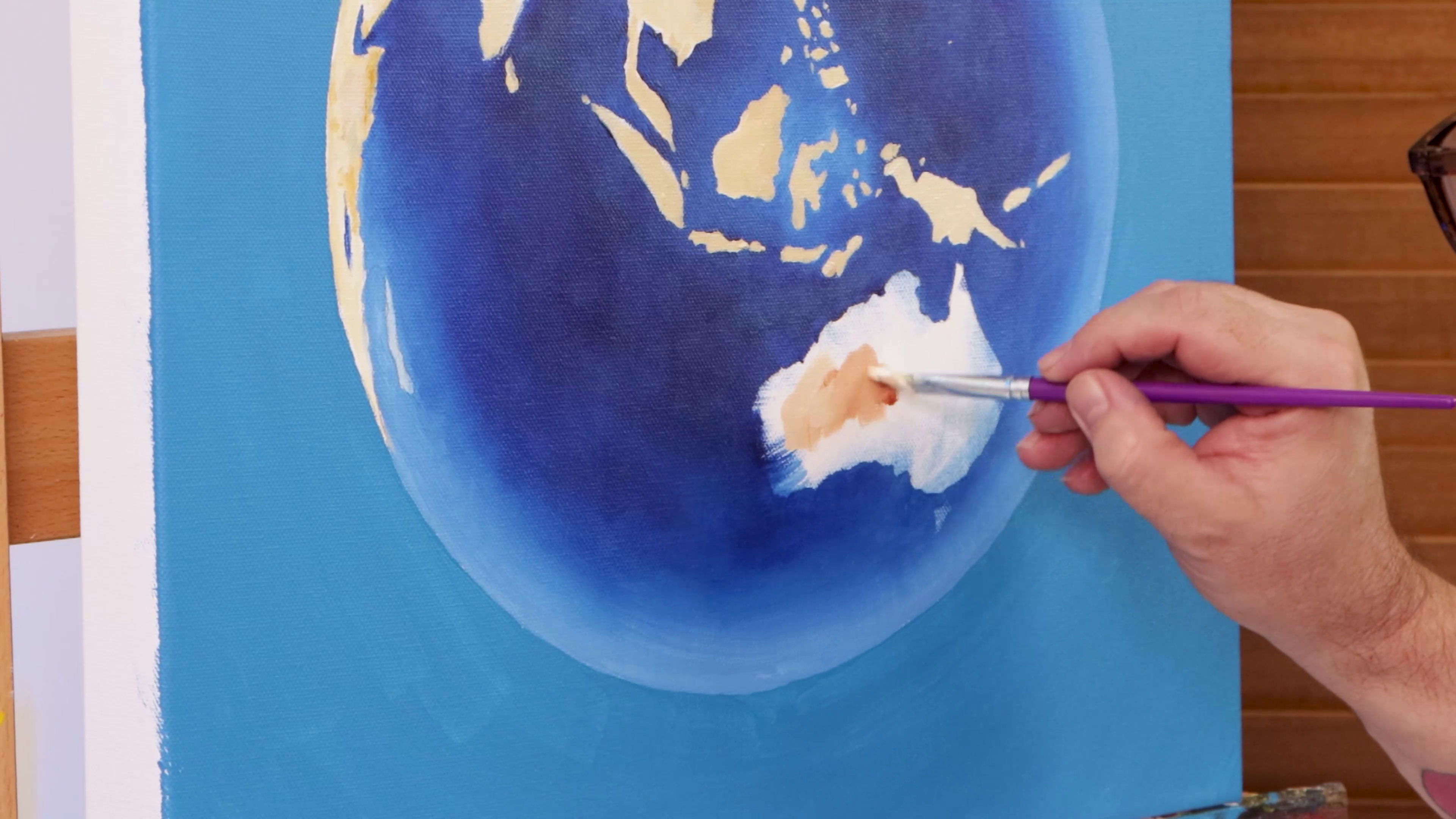 Painting land tones on earth art
