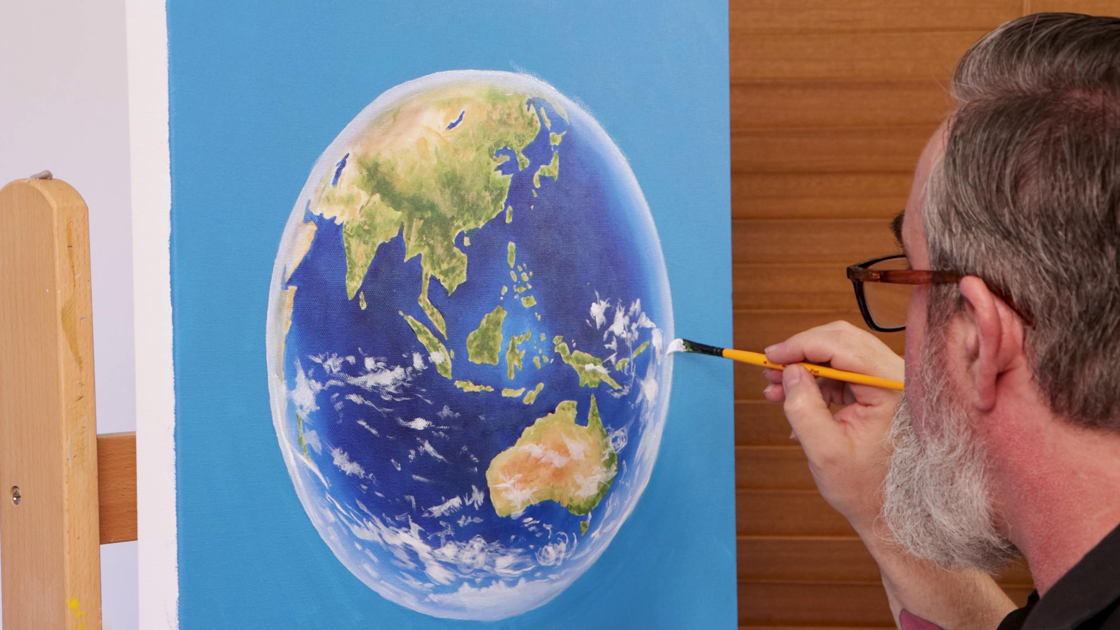Painting clouds onto earth artwork
