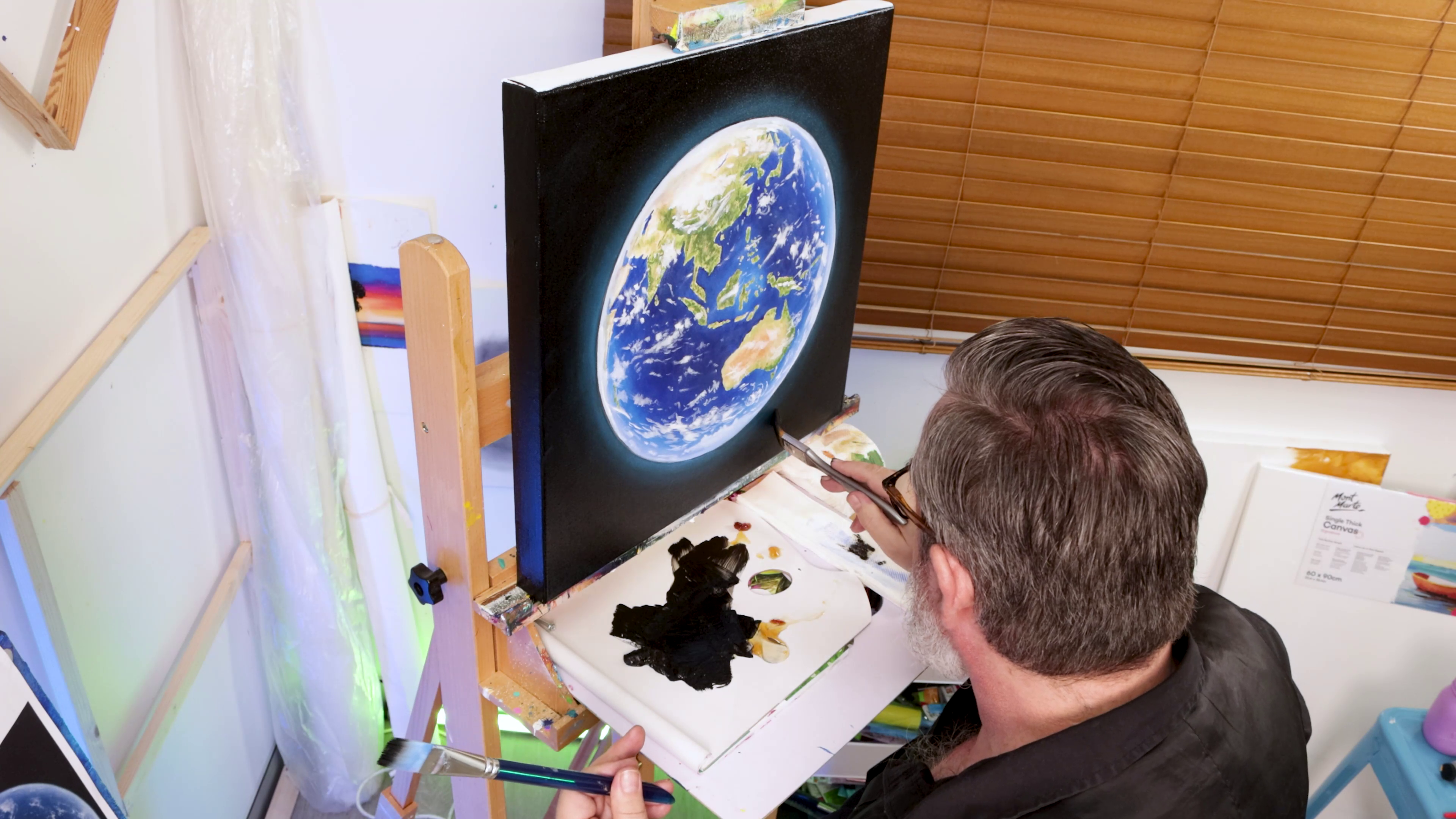 Refining glow around vibrant earth painting on square canvas