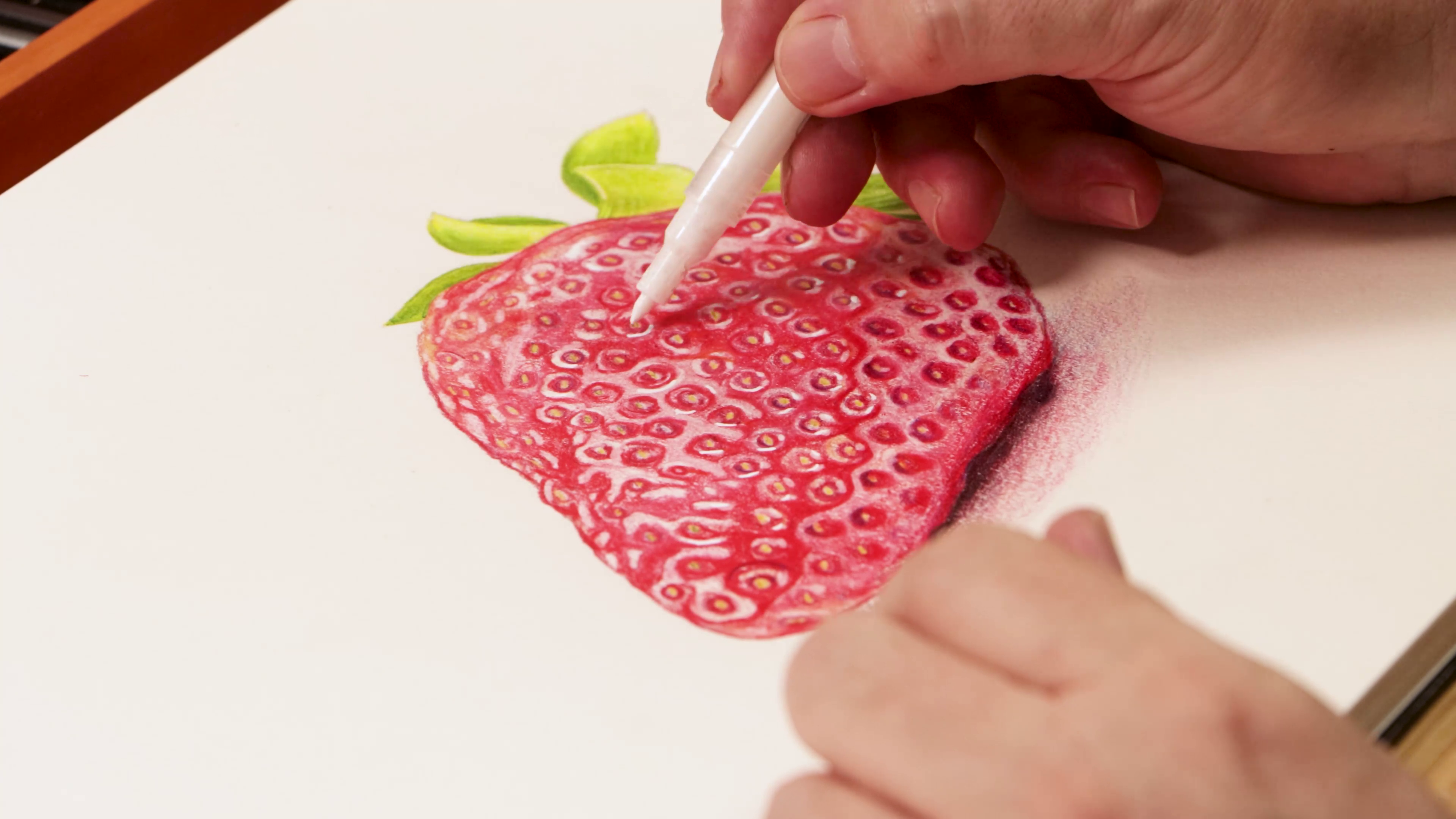 Adding white highlights to strawberry drawing