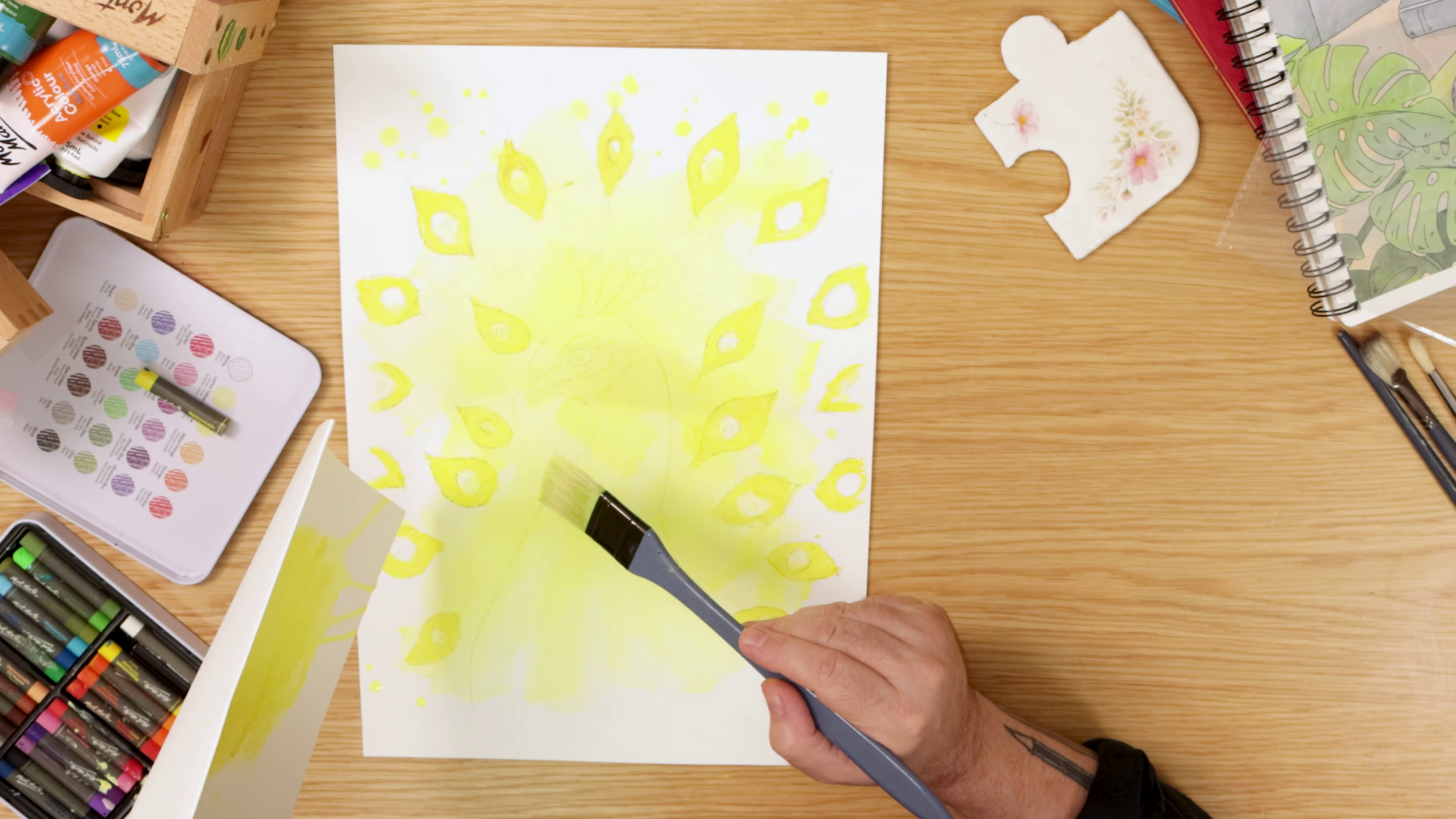 Painting yellow background on peacock art