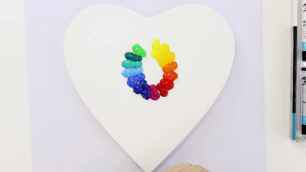 Paint a rainbow abstract painting on a heart shaped canvas – Mont Marte