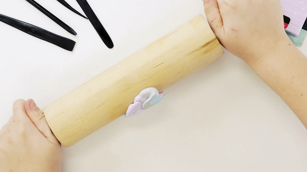 Rolling pin is used to condition the ball of Make n Bake Polymer clay.