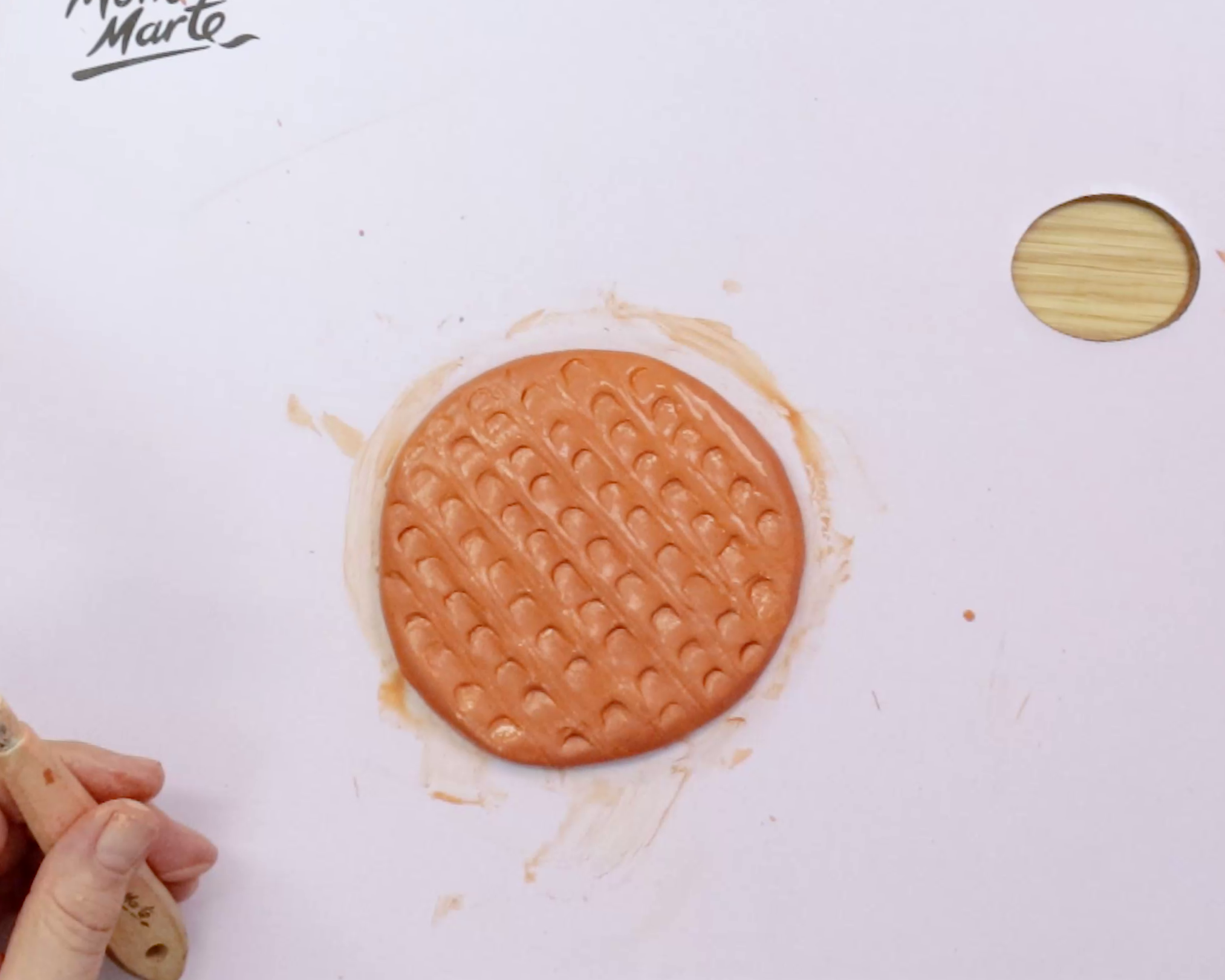 Air dry clay chocolate digestive on white background