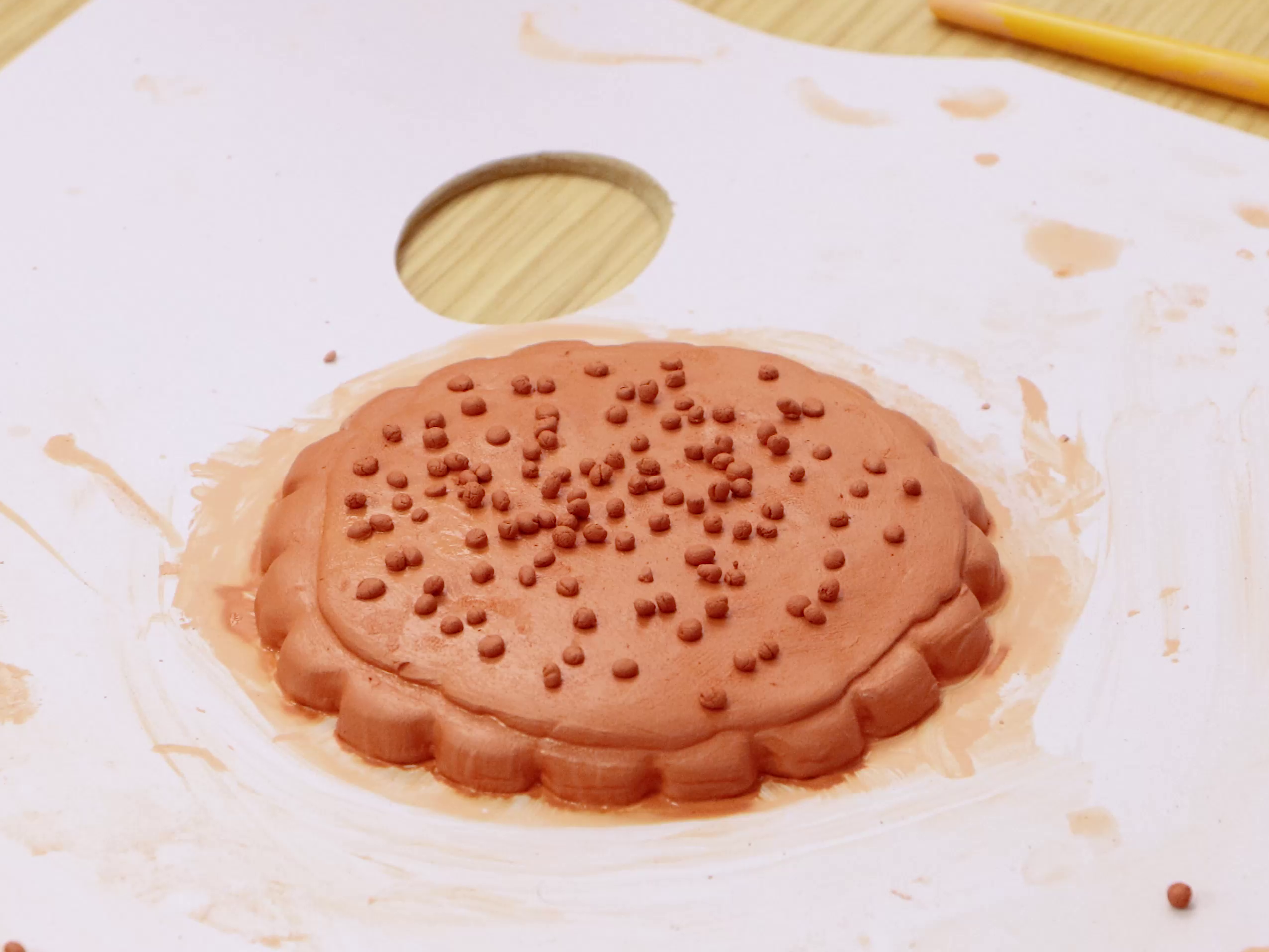 Air dry clay sprinkle cookie on white background