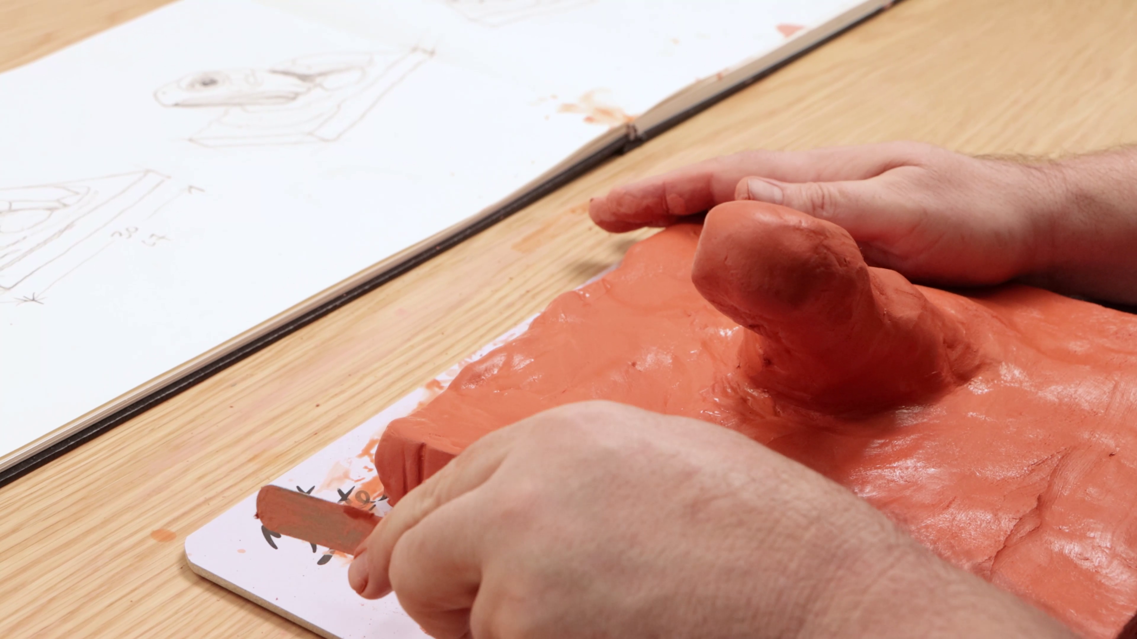 Clay built around brush handle stuck into clay slab