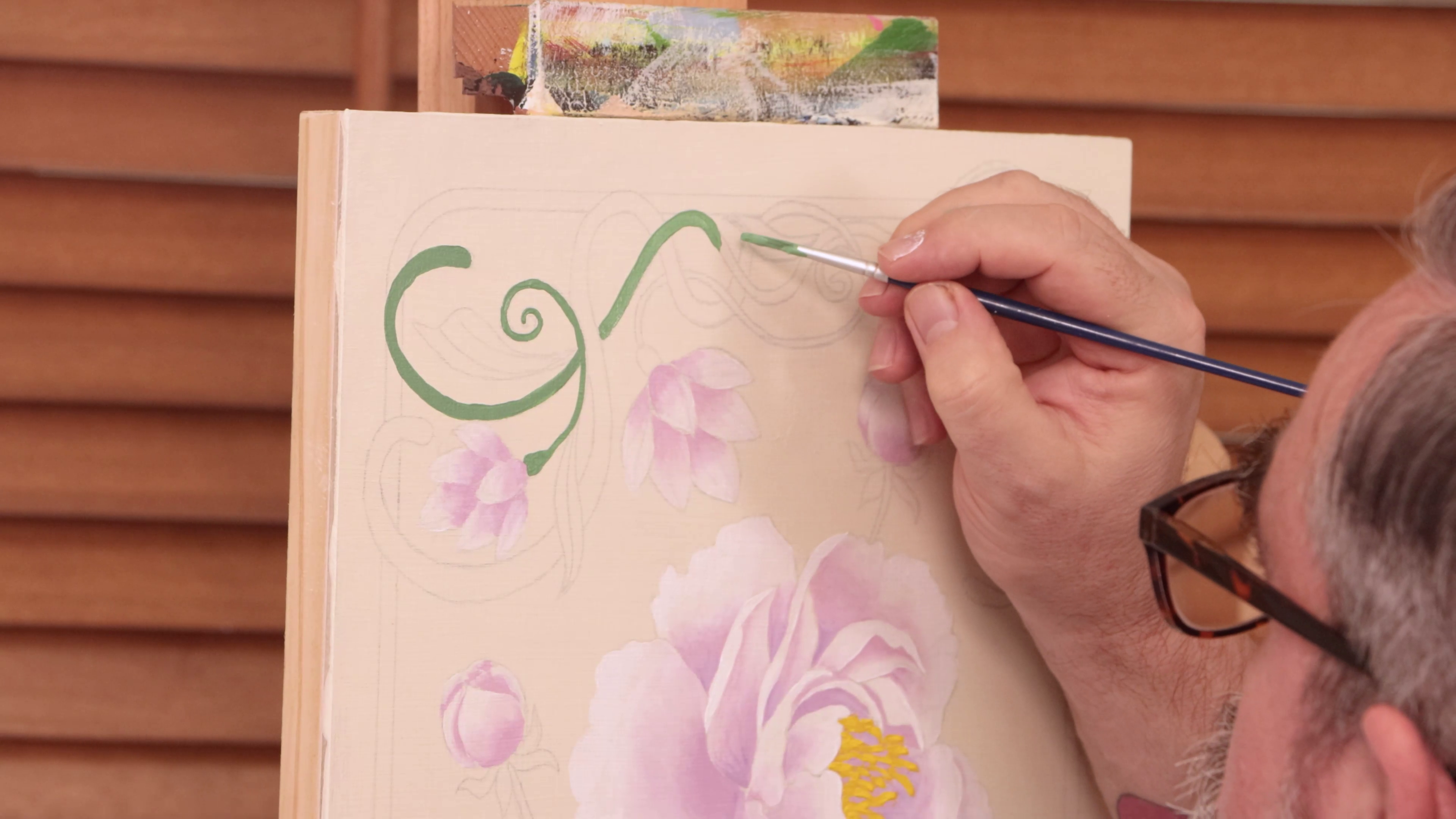 Painting green vines around white and pink peonies