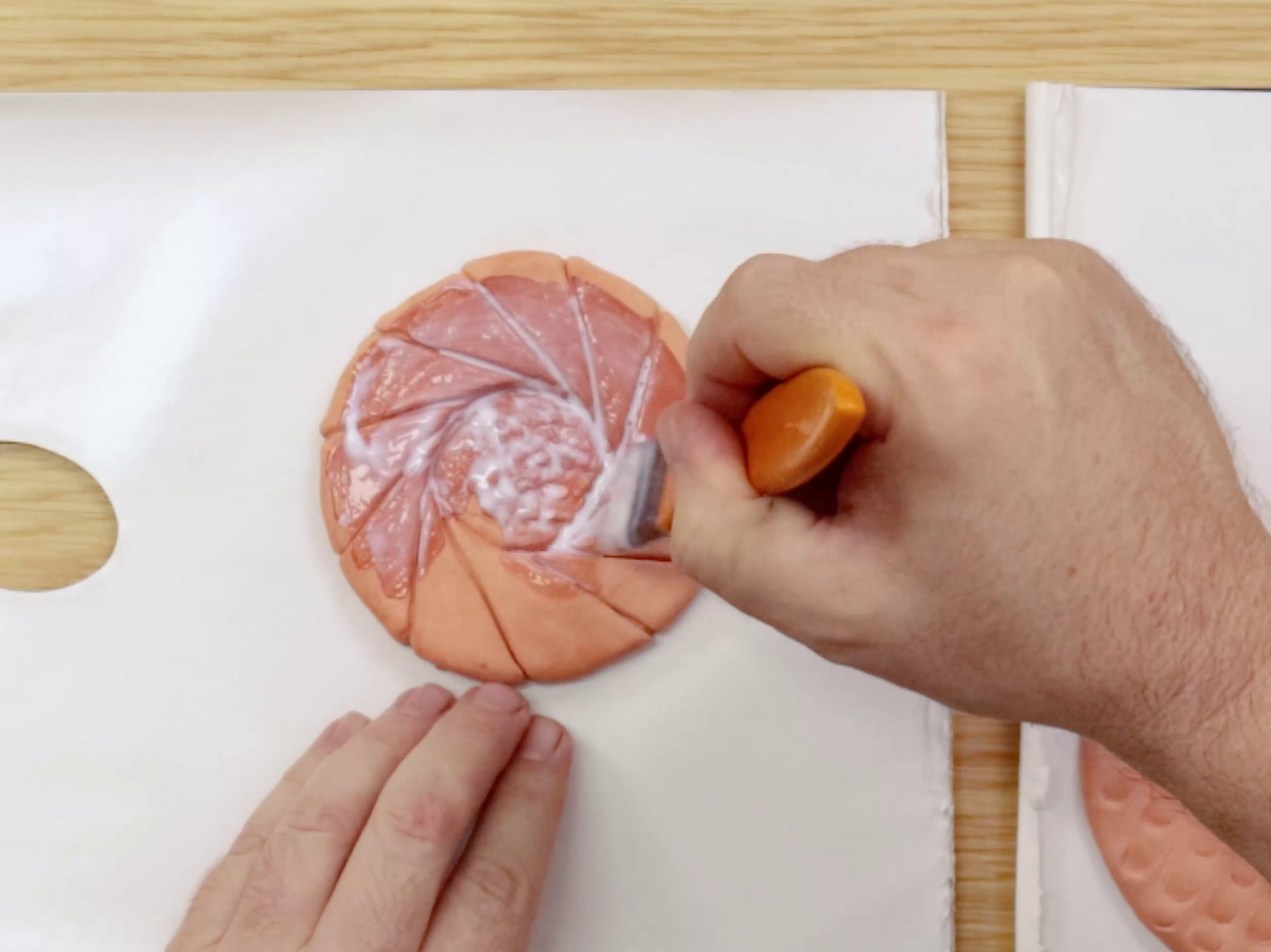 Sealing air dry clay jam drop cookie with glue and water mix