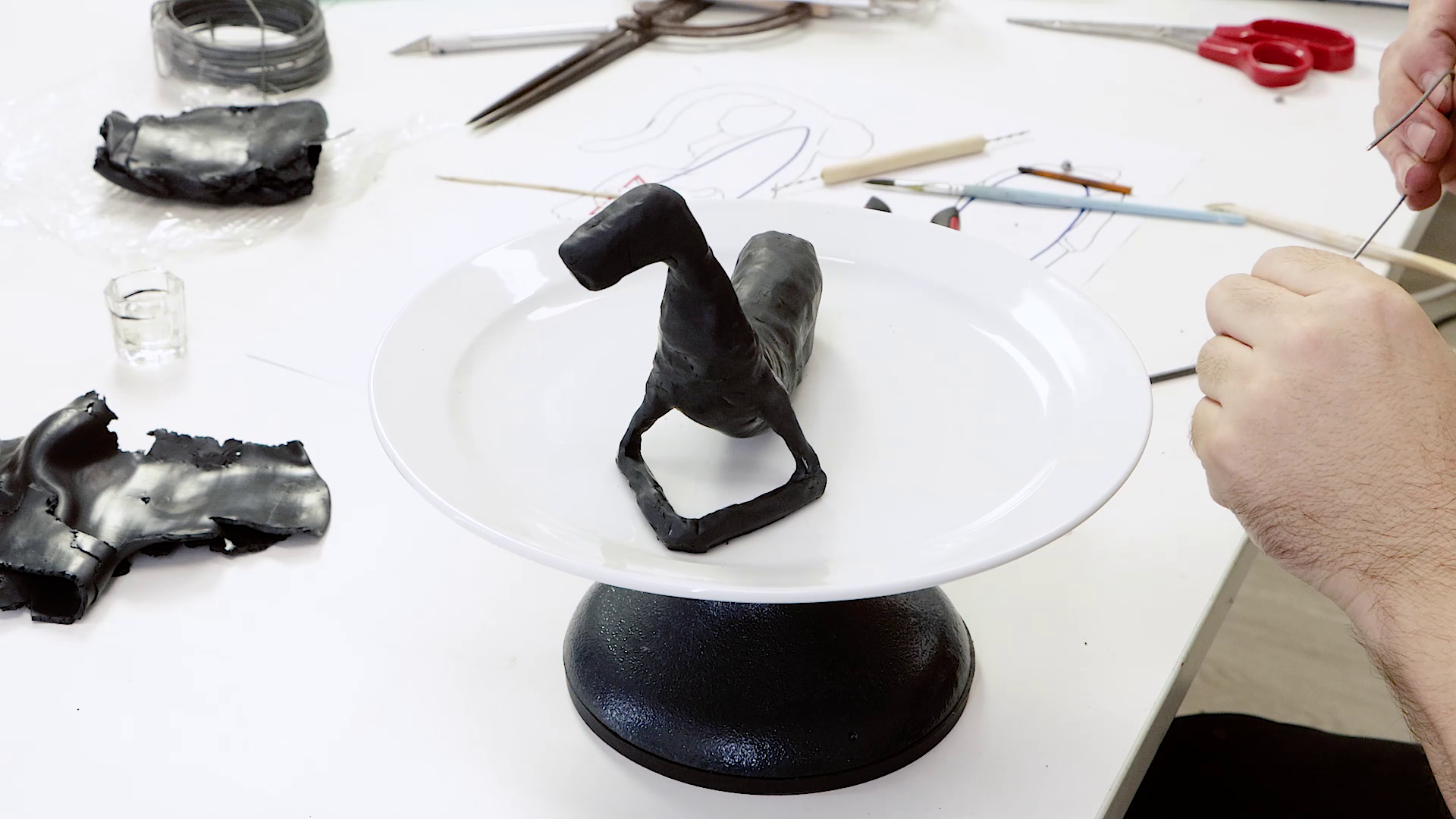 lack polymer clay covering the panther armature