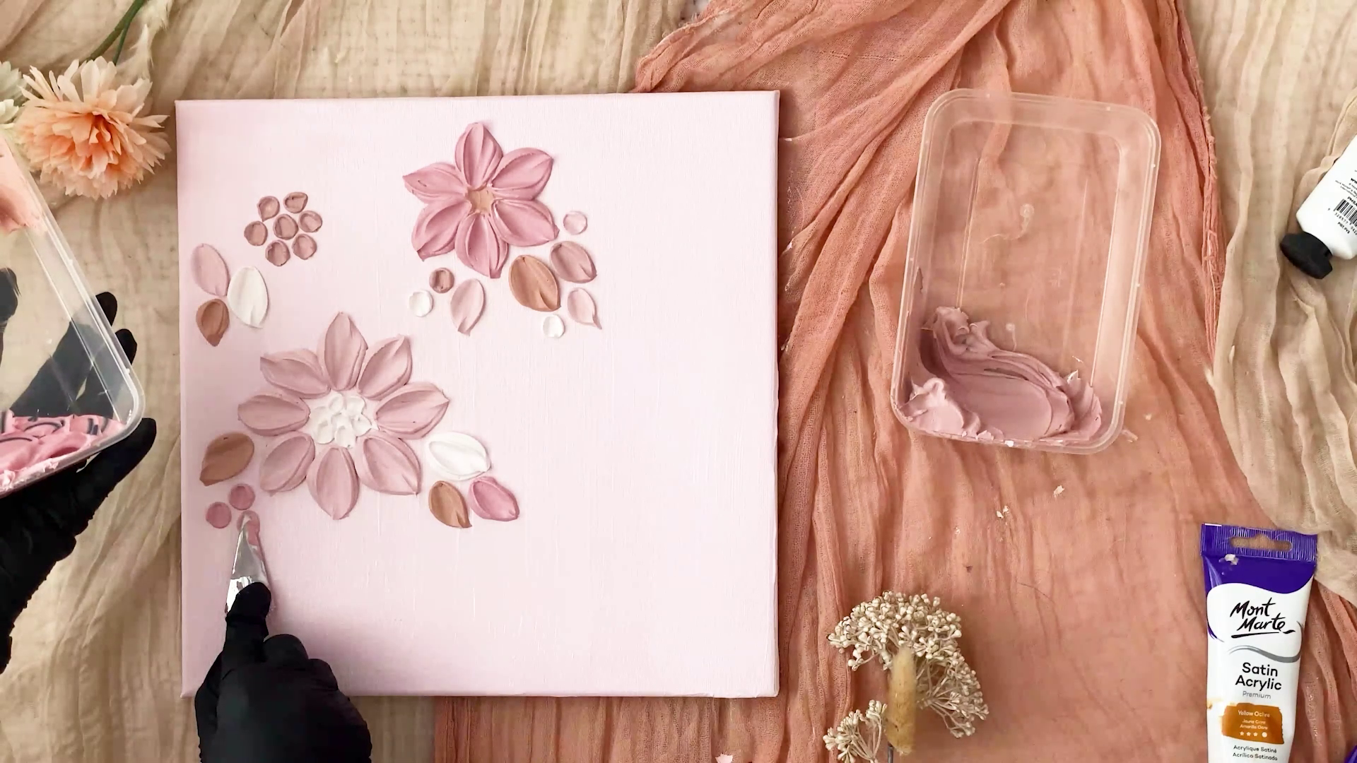 More pinky toned texture flowers being added to canvas with palette knife