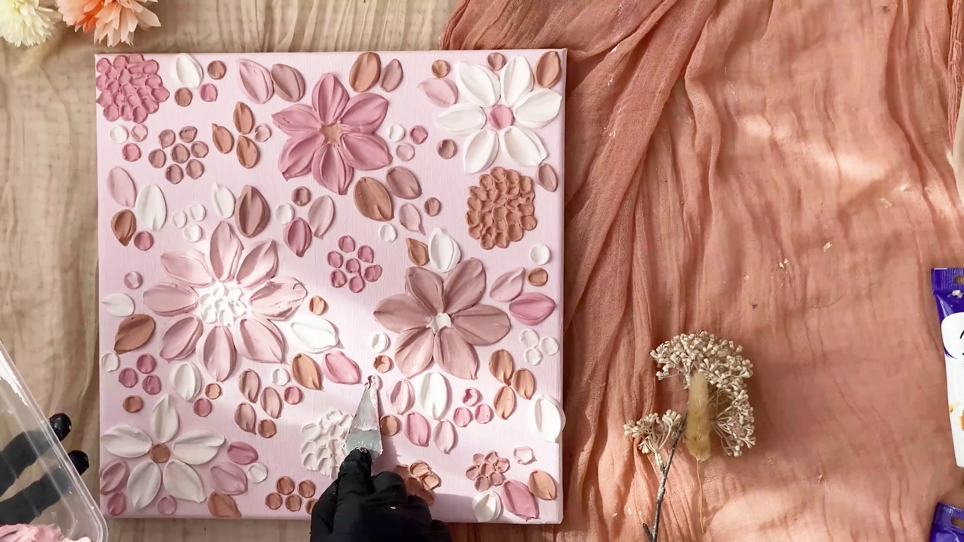 Pink canvas filled with warm pink toned texture flowers