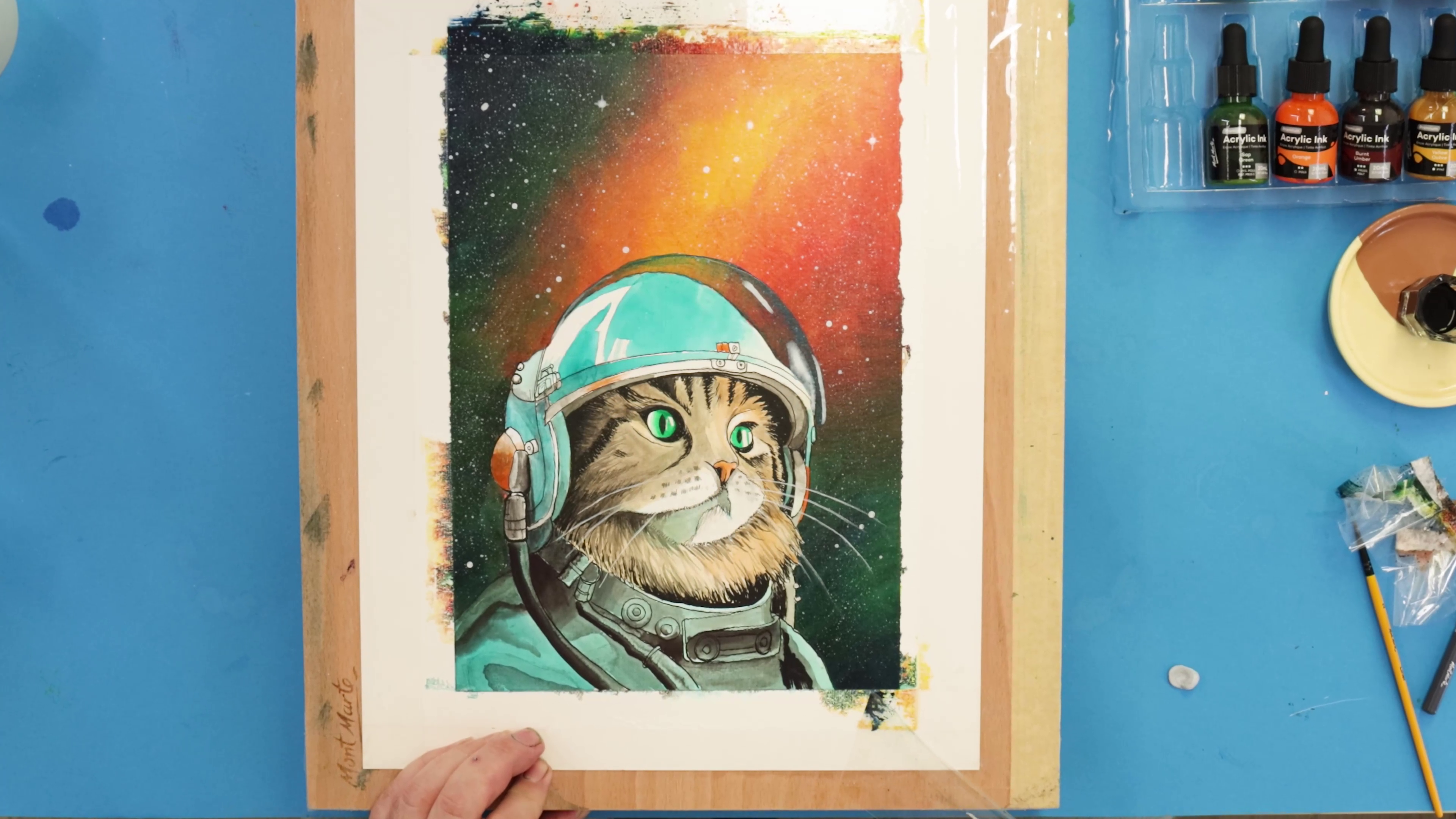 Final picture of space cat artwork with bright green eyes