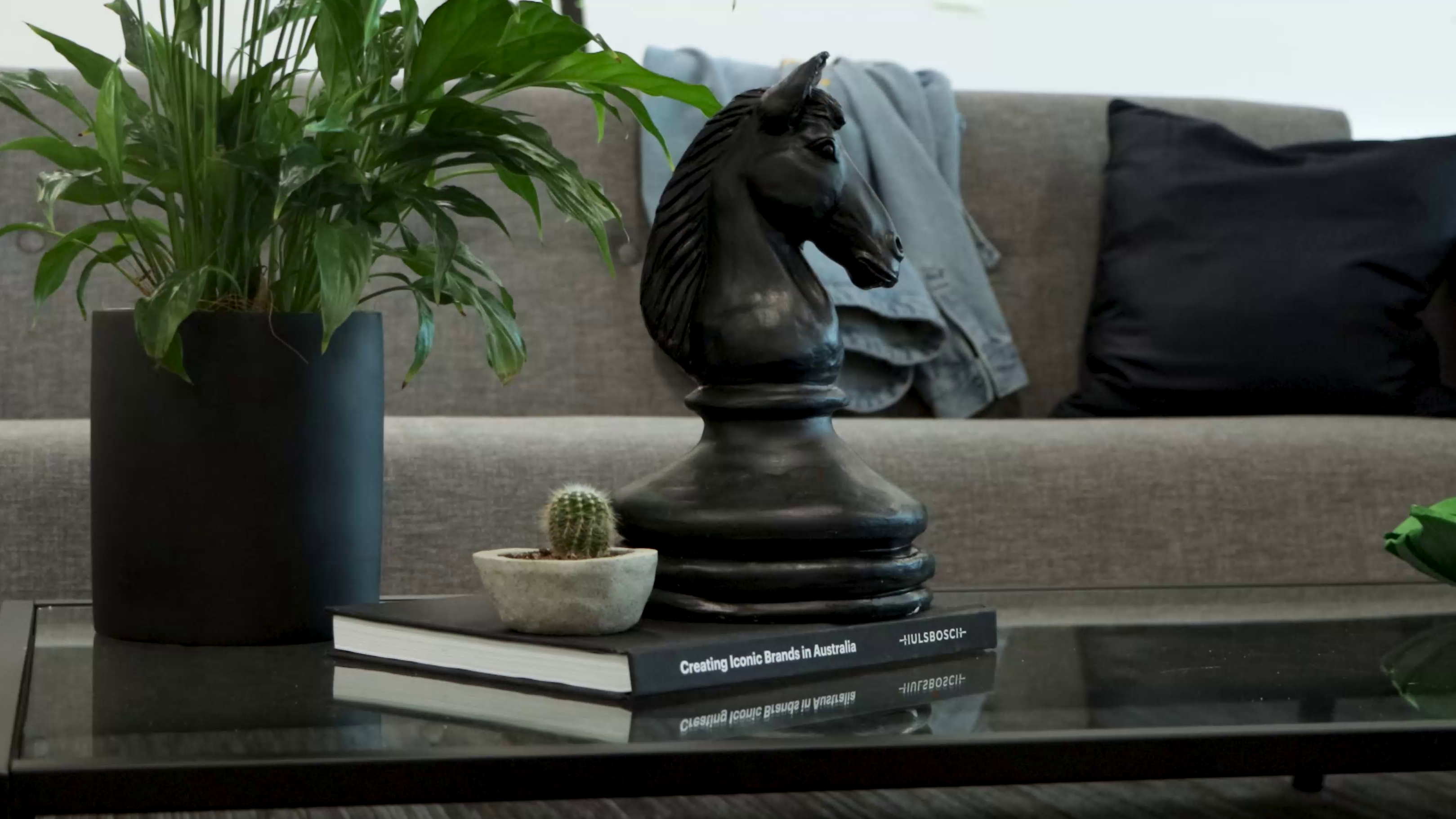 Black matte chess knight on coffee table