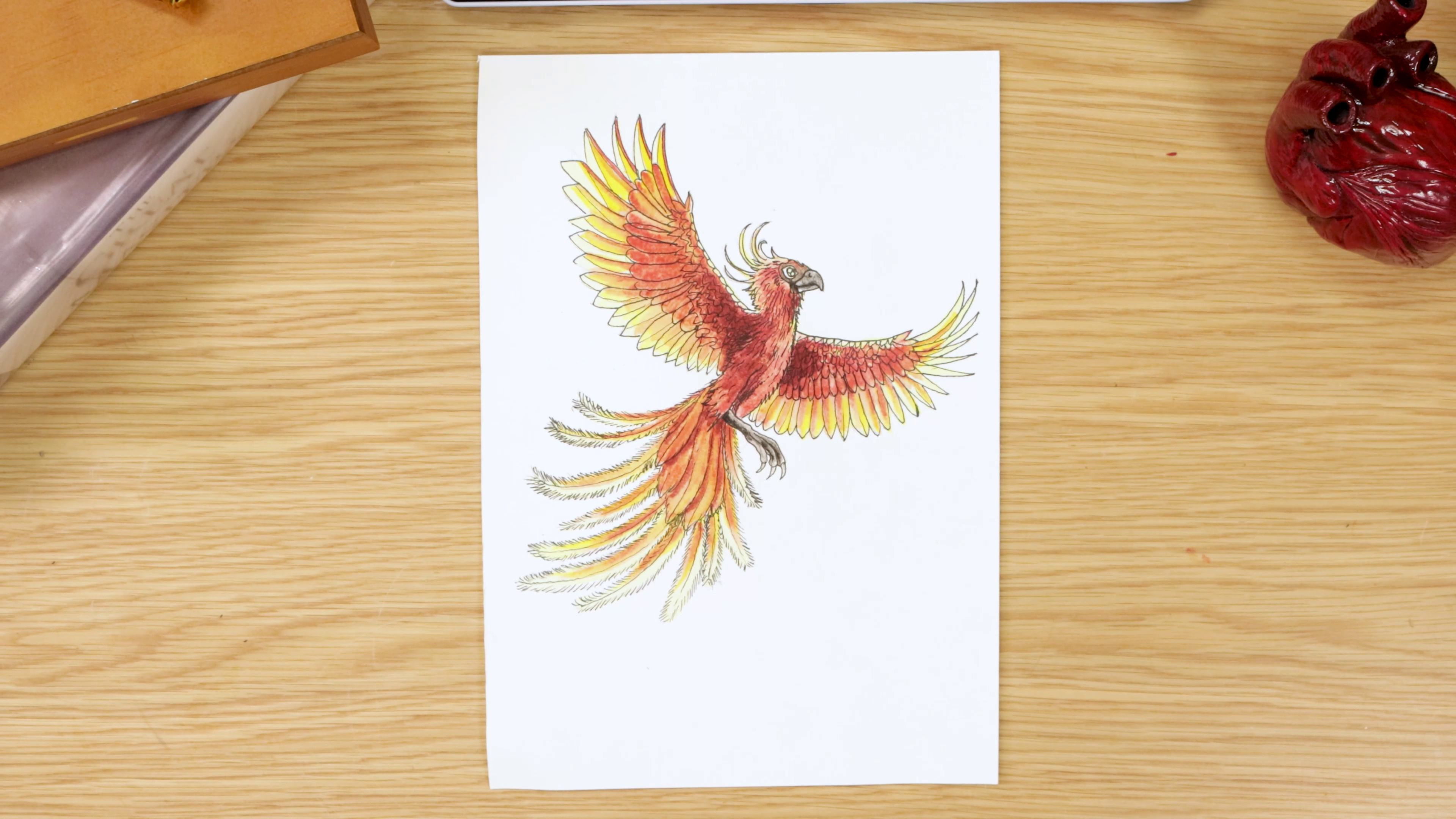 Phoenix artwork on paper on wood desk