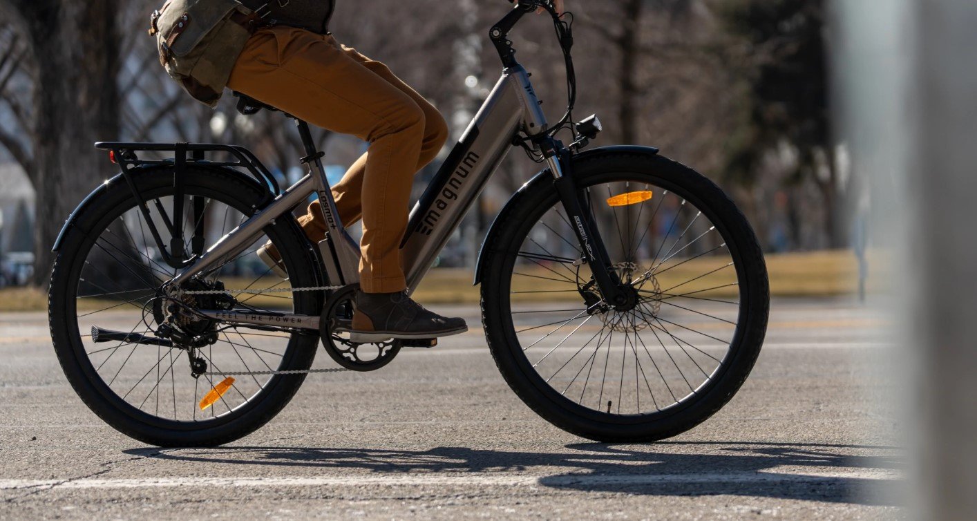 Lower body of rider on a Magnum Cosmo+ with hydraulic brakes on pavement