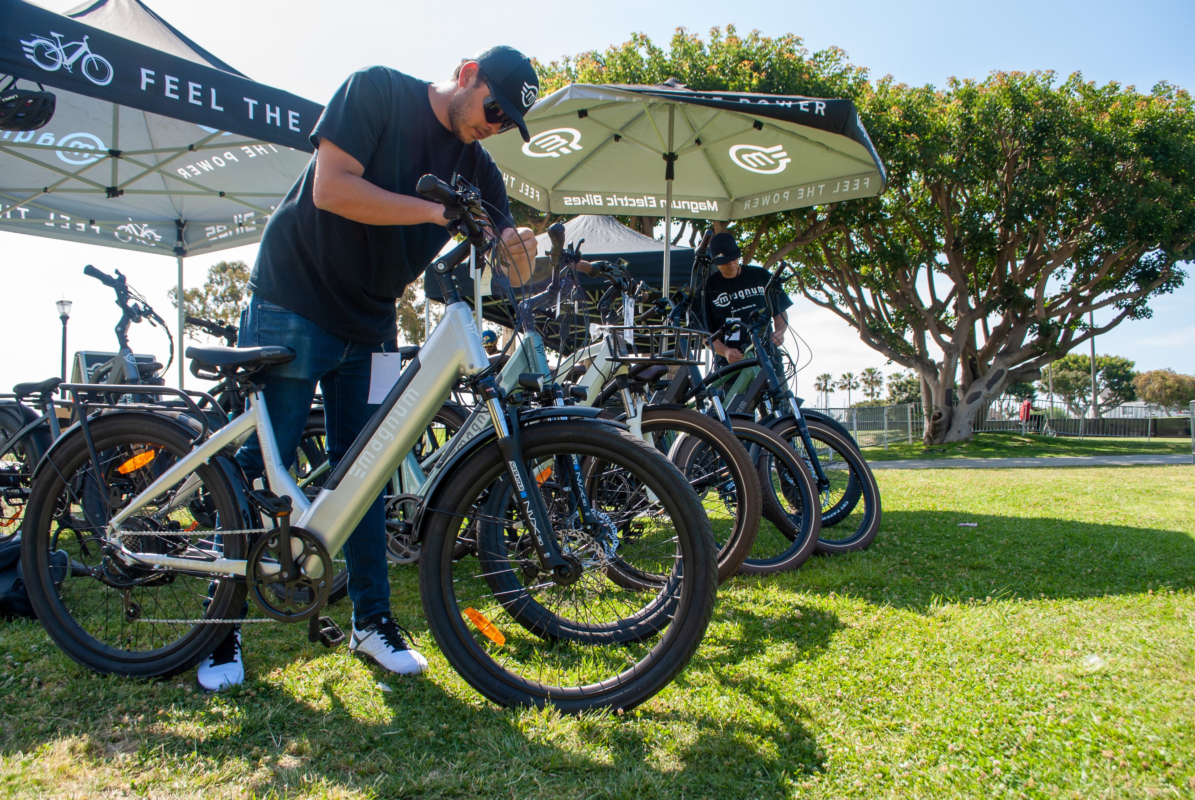 Magnum Bikes outside in grass with trees blue sky