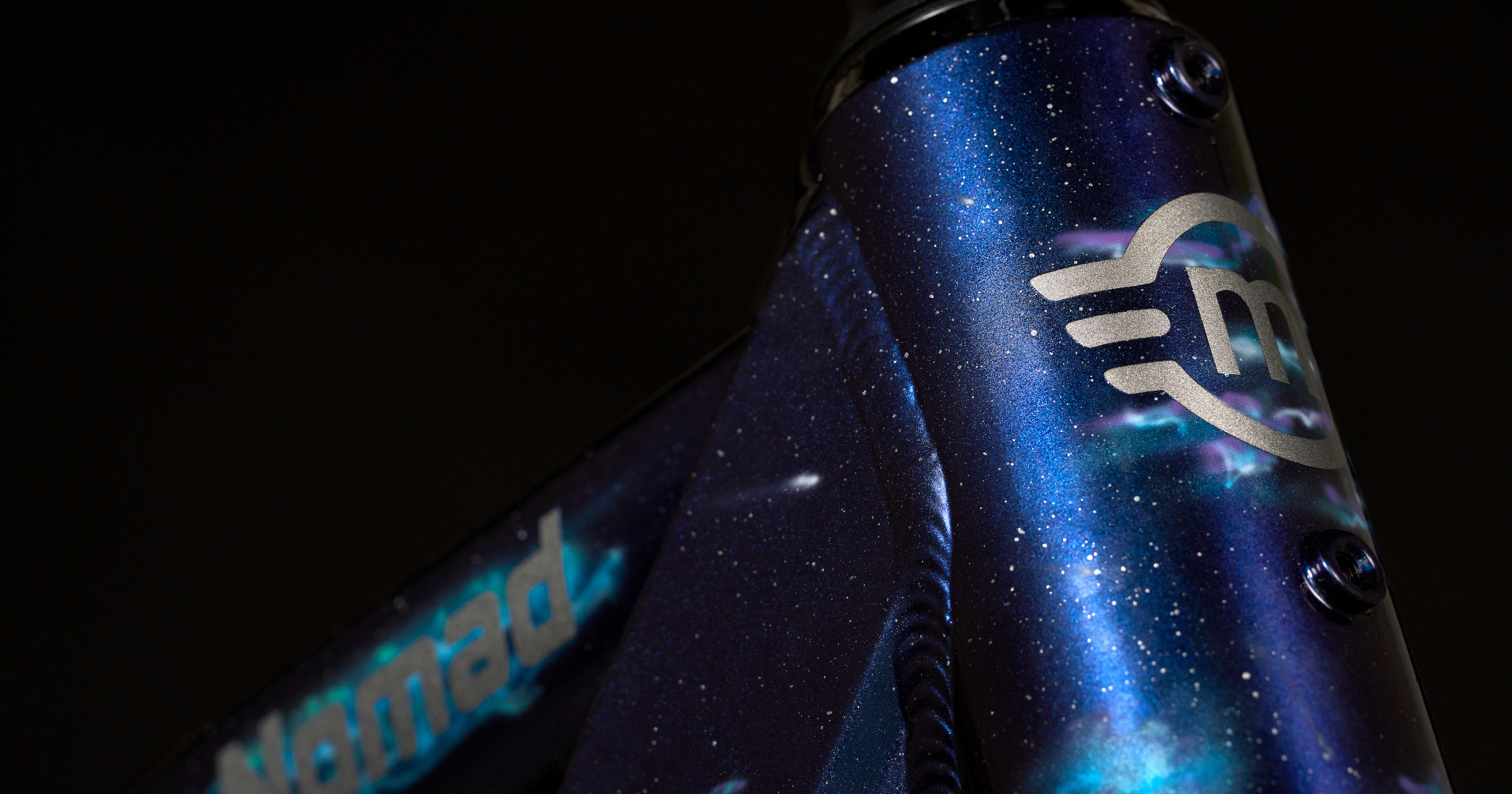 Close up of Magnum Nomad custom-painted galaxy bike blue purple silver