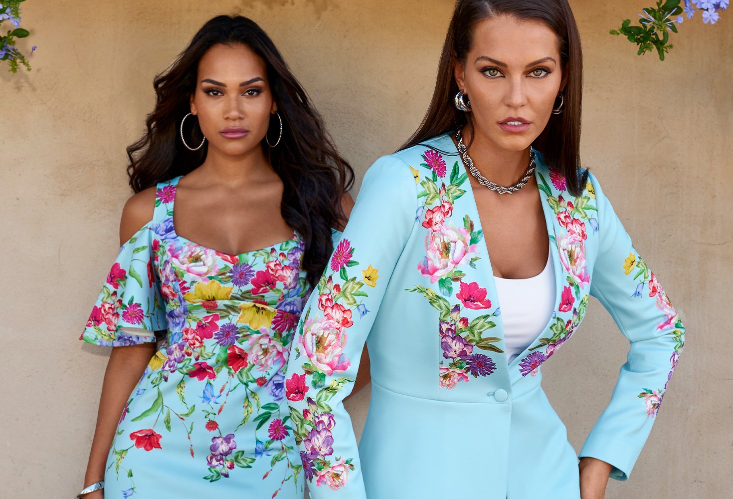 First models wearing a light blue and floral cold shoulder dress while the other model wears a matching blazer.
