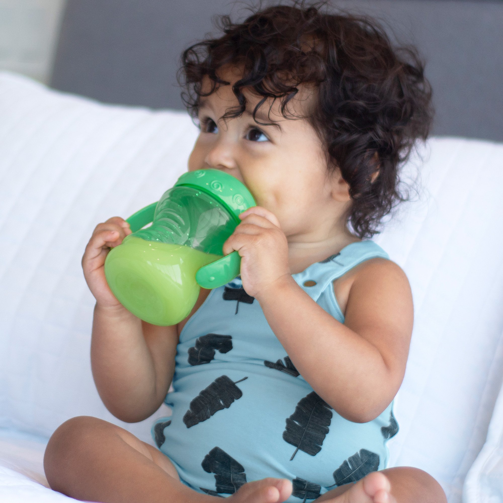 baby drinking from cup